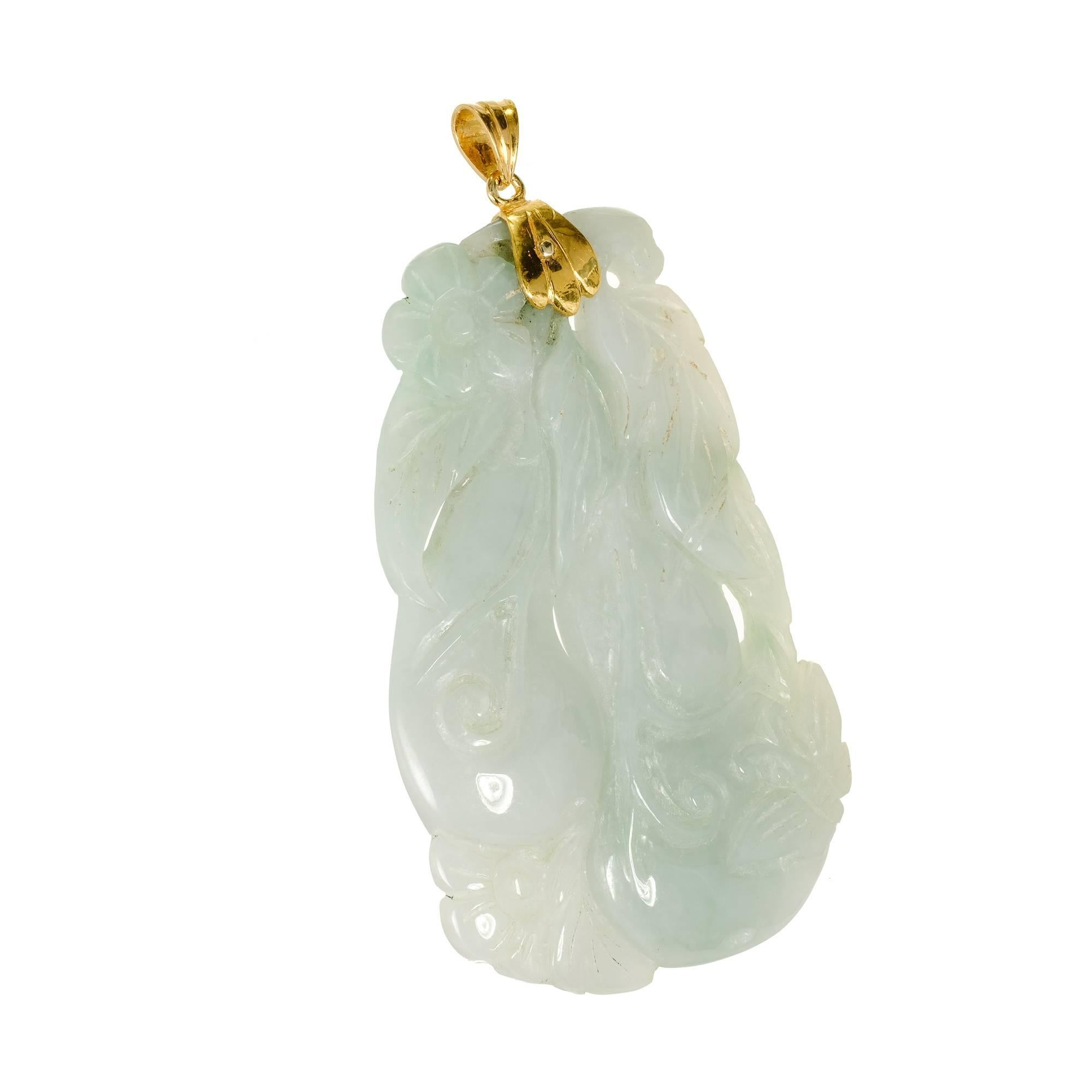 Large translucent Jadeite Jade carved pendant with a 22k gold cap and bail. Mottled light green GIA certified natural.

1 pierced carved mottled light green Jadeite Jade, 68.31 x 45.47 x 8.06mm, GIA certificate #5181636087
14k yellow gold
43.96