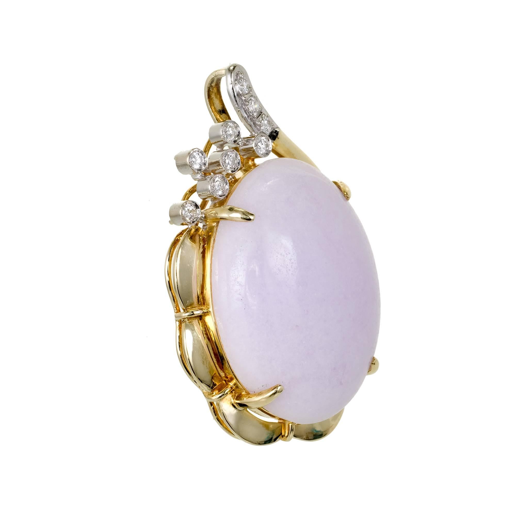 Large natural purple Jadeite Jade pendant in a 14k yellow and white gold swirl handmade setting with bright white full cut Diamond accents.

1 oval cabochon purple Jadeite Jade, 26.98 x 20.2 x 8.3mm
9 round Diamonds, approx. total weight .20cts, H,