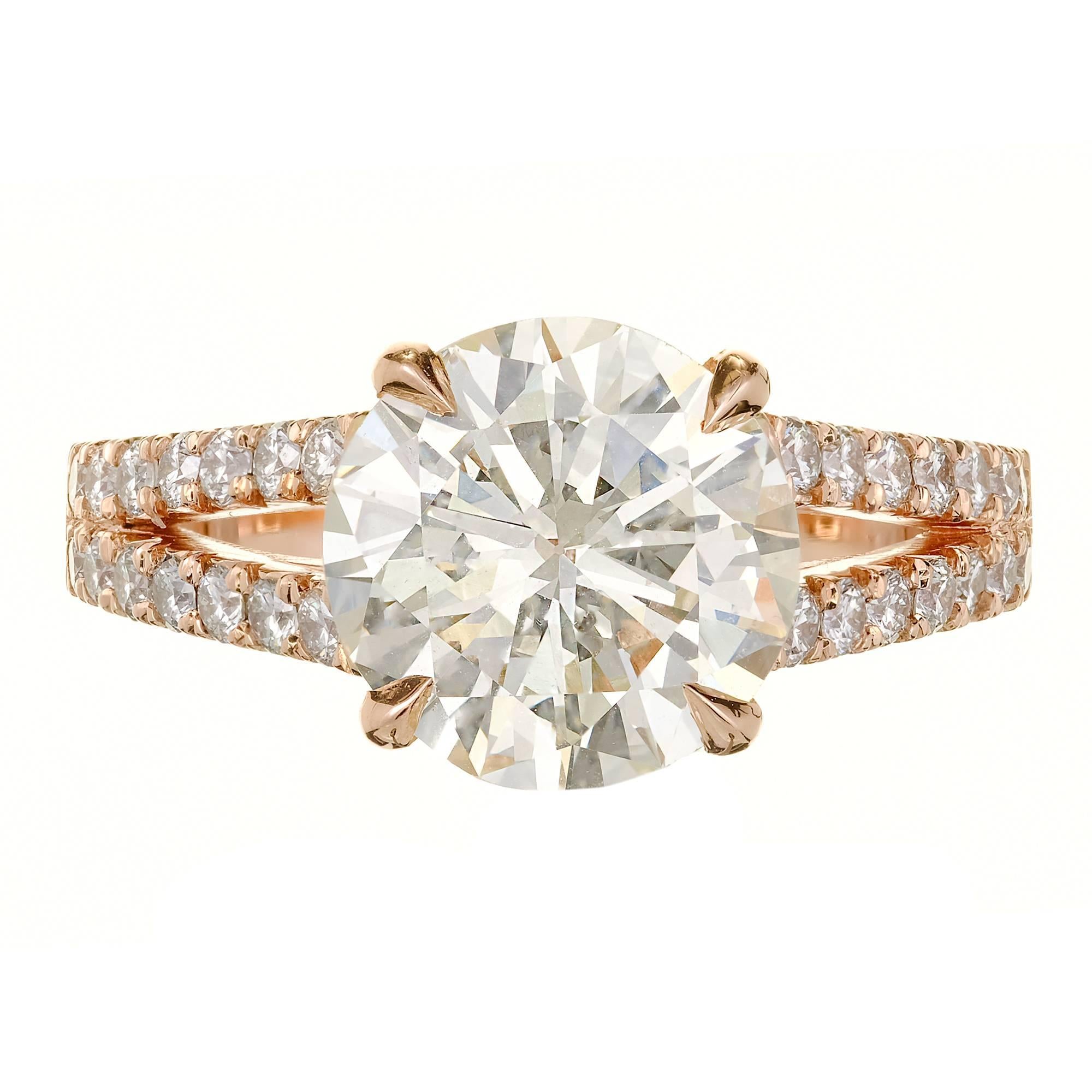 Peter Suchy custom design 14k gold split shank Diamond engagement ring. Designed to sit low to the finger and still allow a wedding band to sit flush to the engagement ring. The ring was designed to show off the brilliance and sparkle of this