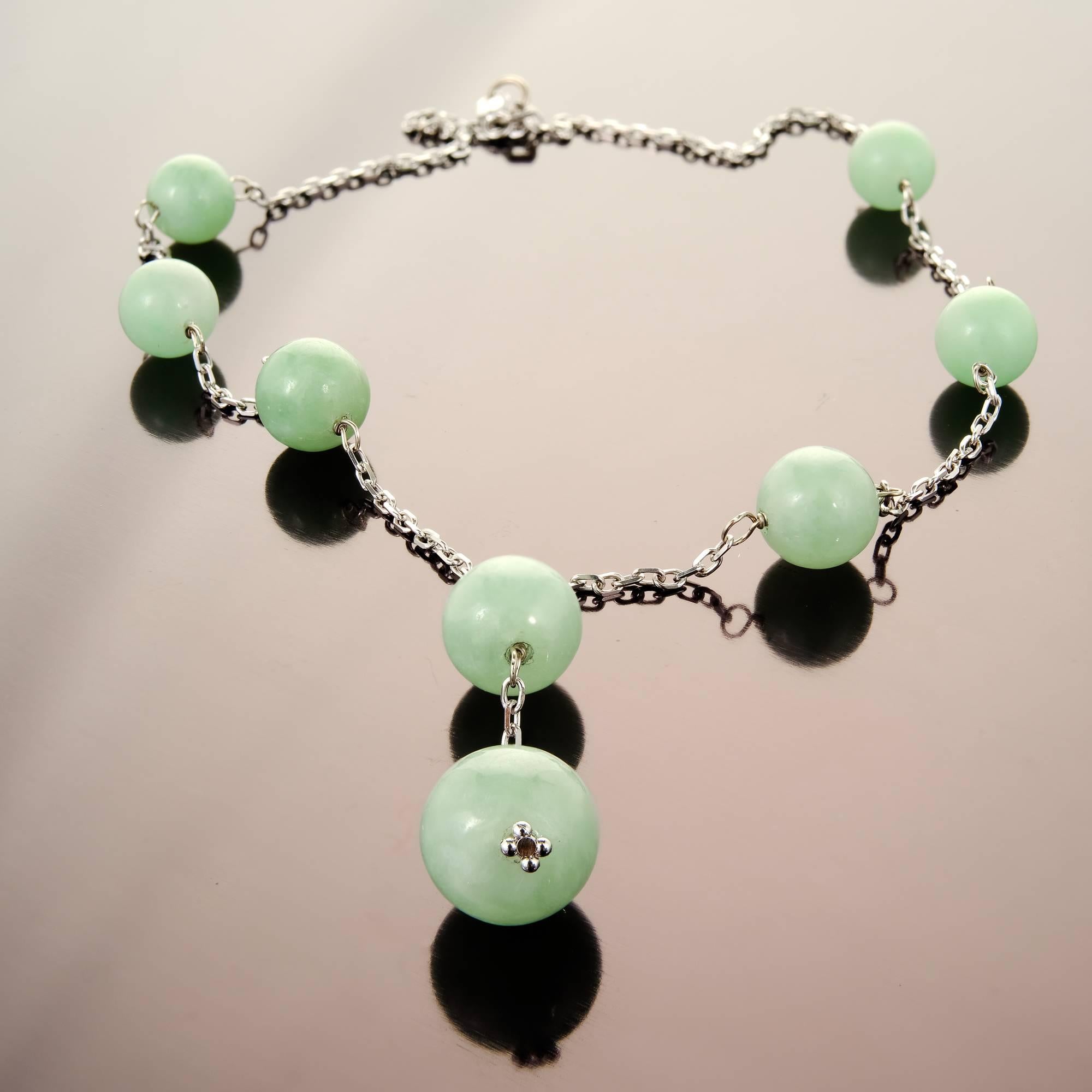 Natural Jadeite Jade certified light green 8 bead Jade By The Yard style necklace on a 16 inch 14k white gold chain.

8 light green natural Jadeite Jade beads, 9 – 12mm, GIA certificate #5181602073
14k white gold
Tested and stamped: 14k
15.6