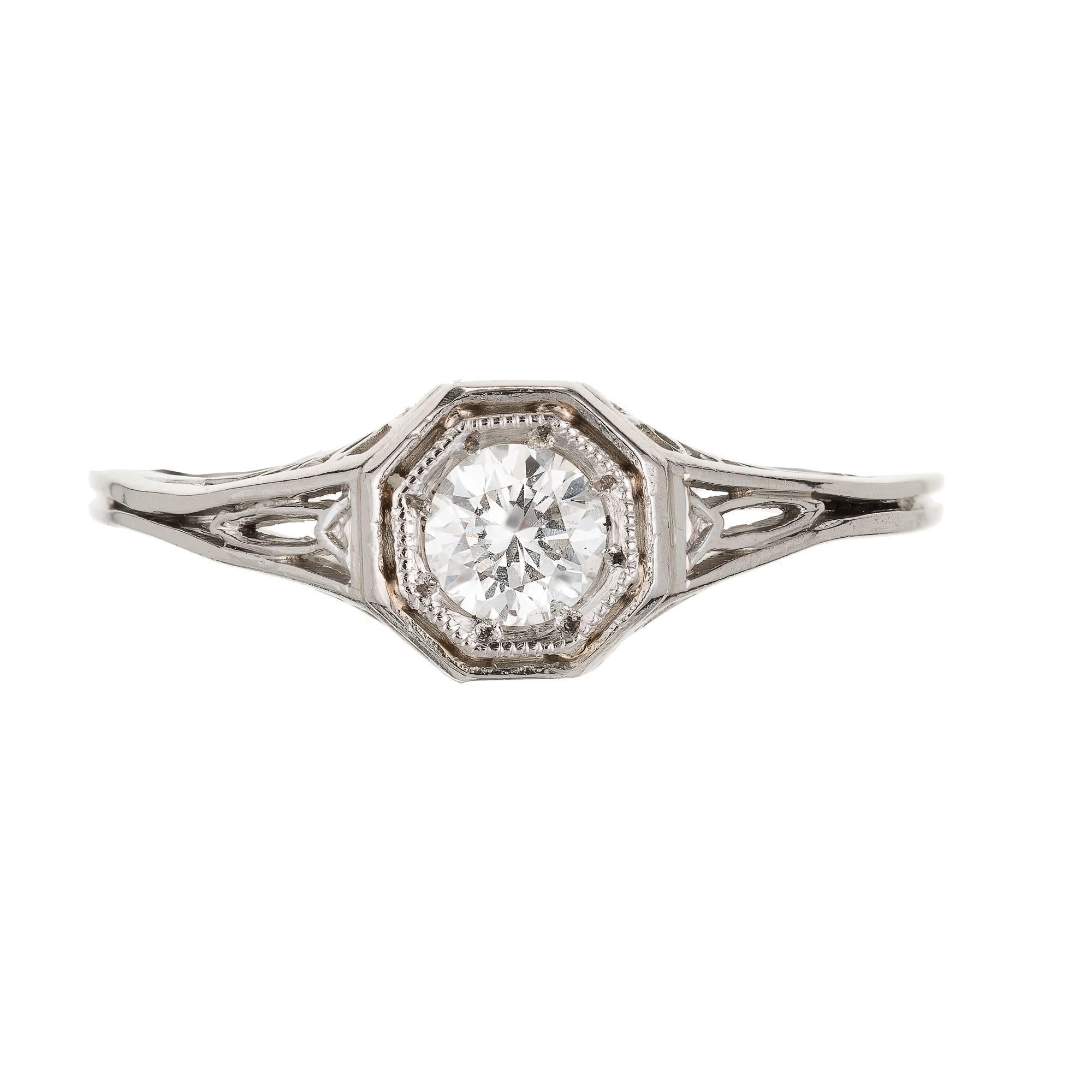 All original antique Art Deco Platinum engagement ring circa 1930 – 1940 with a delicate handmade pierced ring and a very bright well cut transitional brilliant cut Diamond EGL certified .23cts F – G color, SI1.

1 round transitional brilliant cut