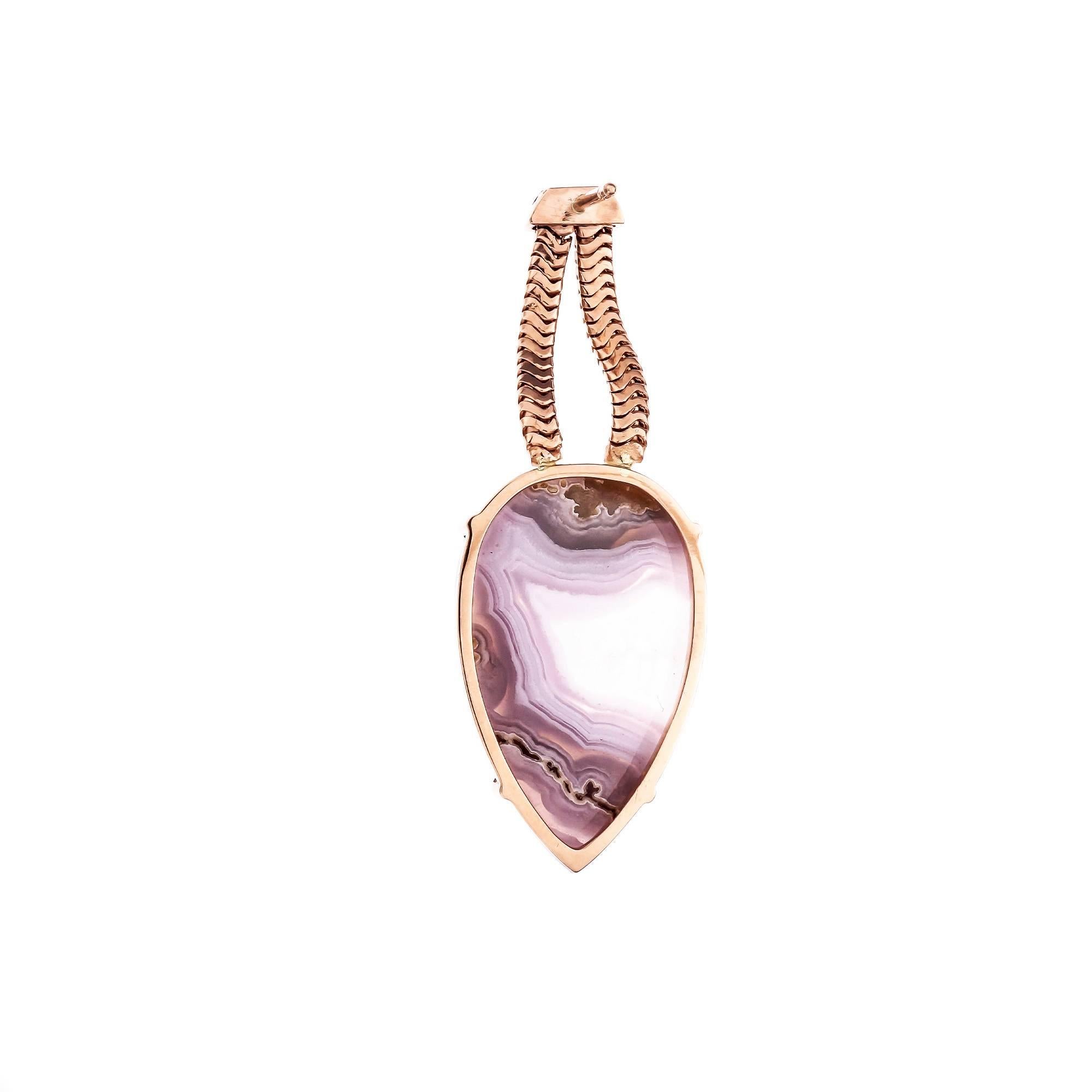 Peter Suchy natural lace Agate dangle earrings handmade in 14k rose gold with a matched pair of pinkish purple lace translucent.

2 pear shape purple pink lace Agate, approx. total weight 27.35cts, natural inclusions
14k rose gold
13.0 grams
Tested: