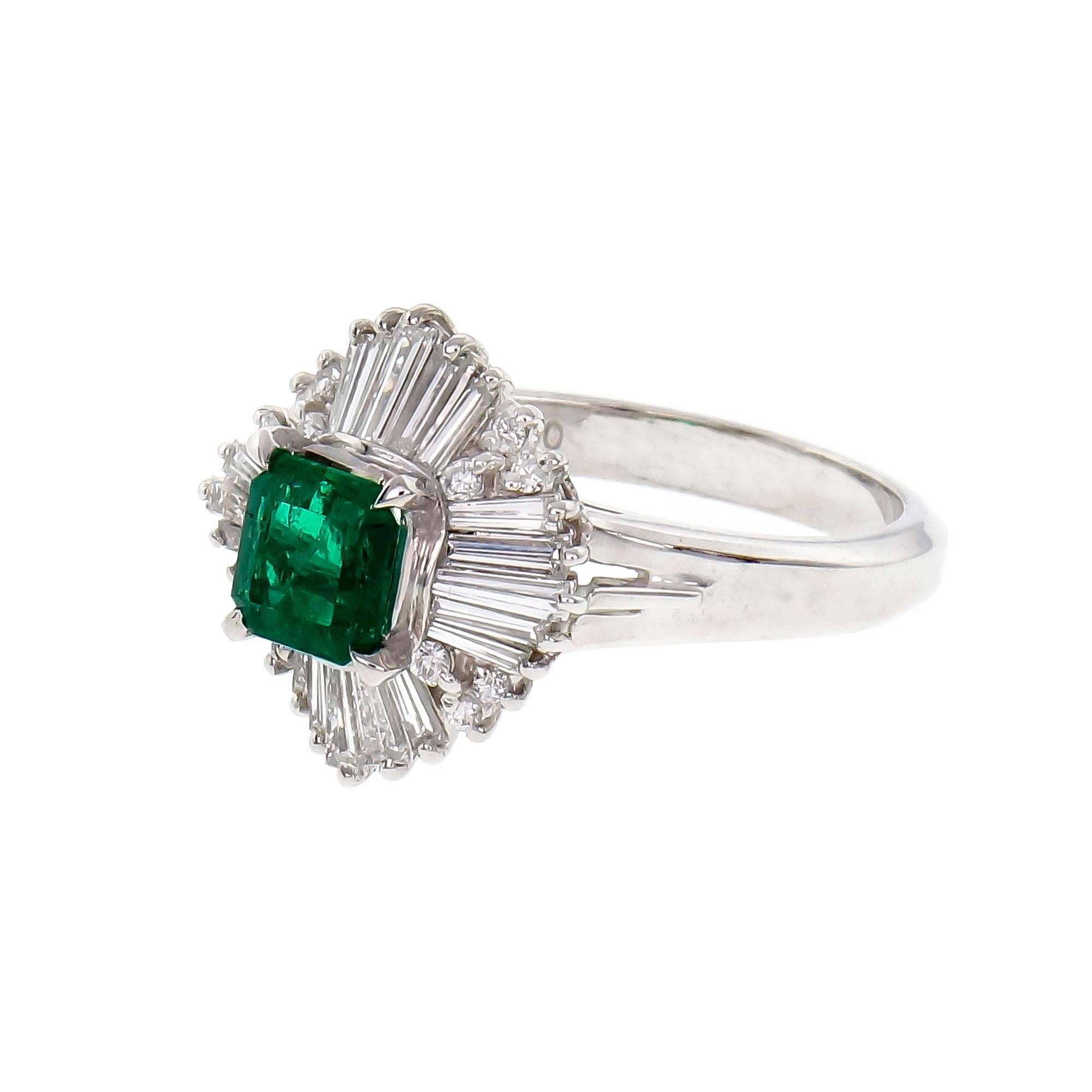 1960’s handmade Platinum Ballerina ring designed and made to show off a top color bright green natural Emerald. GIA certified natural Emerald low-level clarity enhancement F1. Very bright color, moderate plus inclusions.

1 octagonal Emerald cut