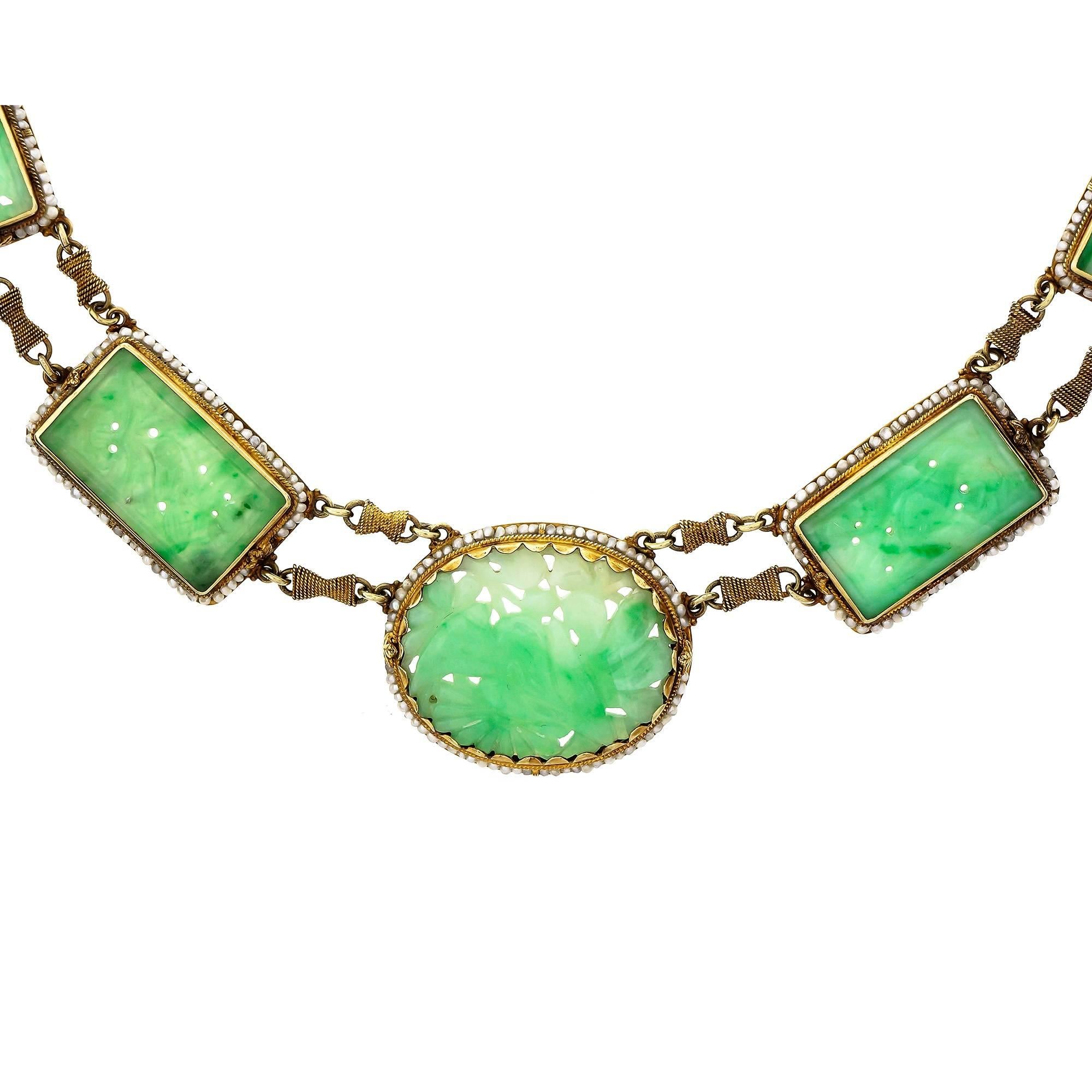 1910 completely handmade necklace with natural carved Jadeite Jade carved tablets surrounded by natural pearls on a handmade twisted wire link chain. All original with natural patina and not polished.

1 carved oval mottled green Jadeite Jade