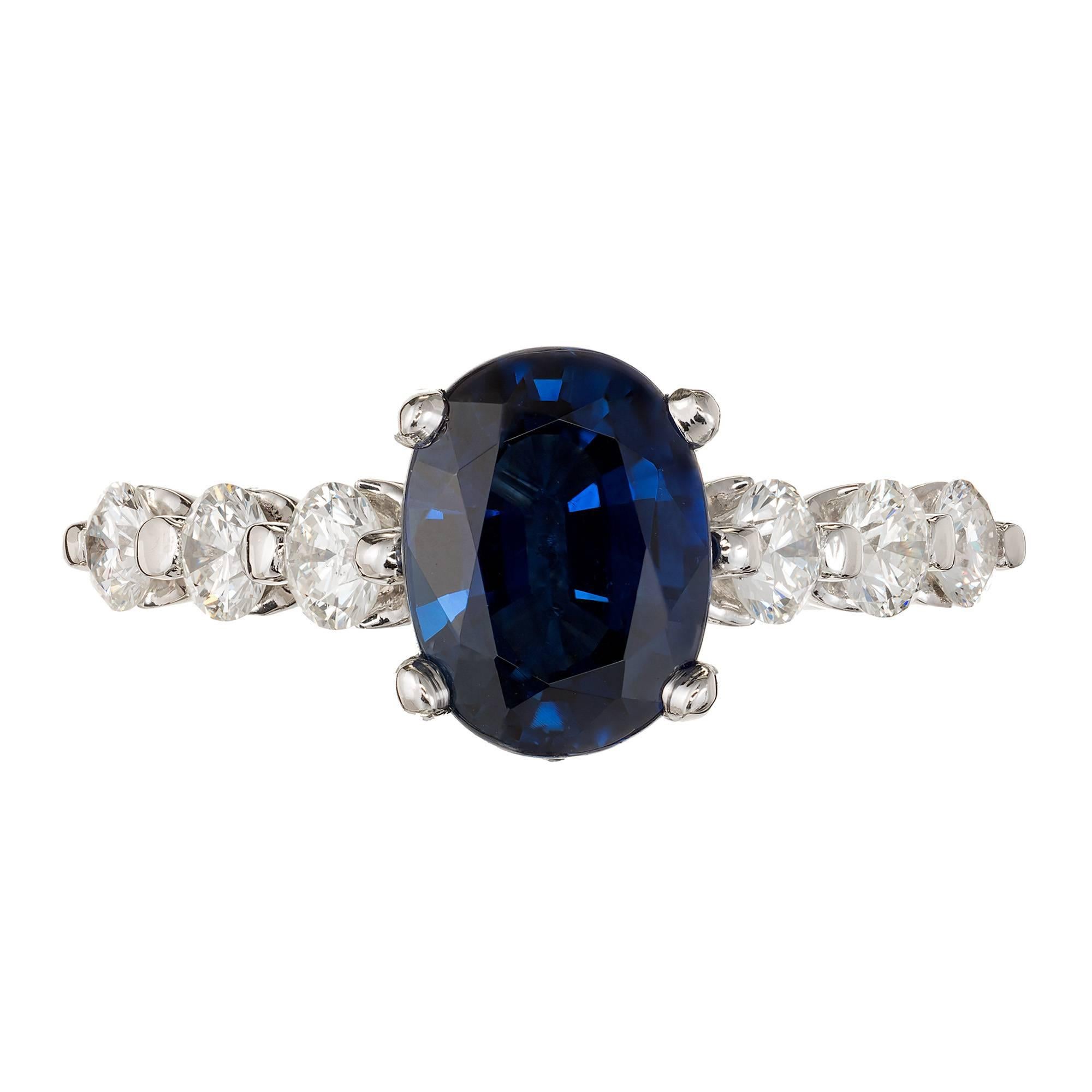 Oval cornflower blue sapphire and diamond engagement ring. Natural no heat 2.27 oval GIA certified center stone in a common prong setting with six white Ideal cut diamonds along the shank, crafted in the Peter Suchy workshop.

1 cornflower dark