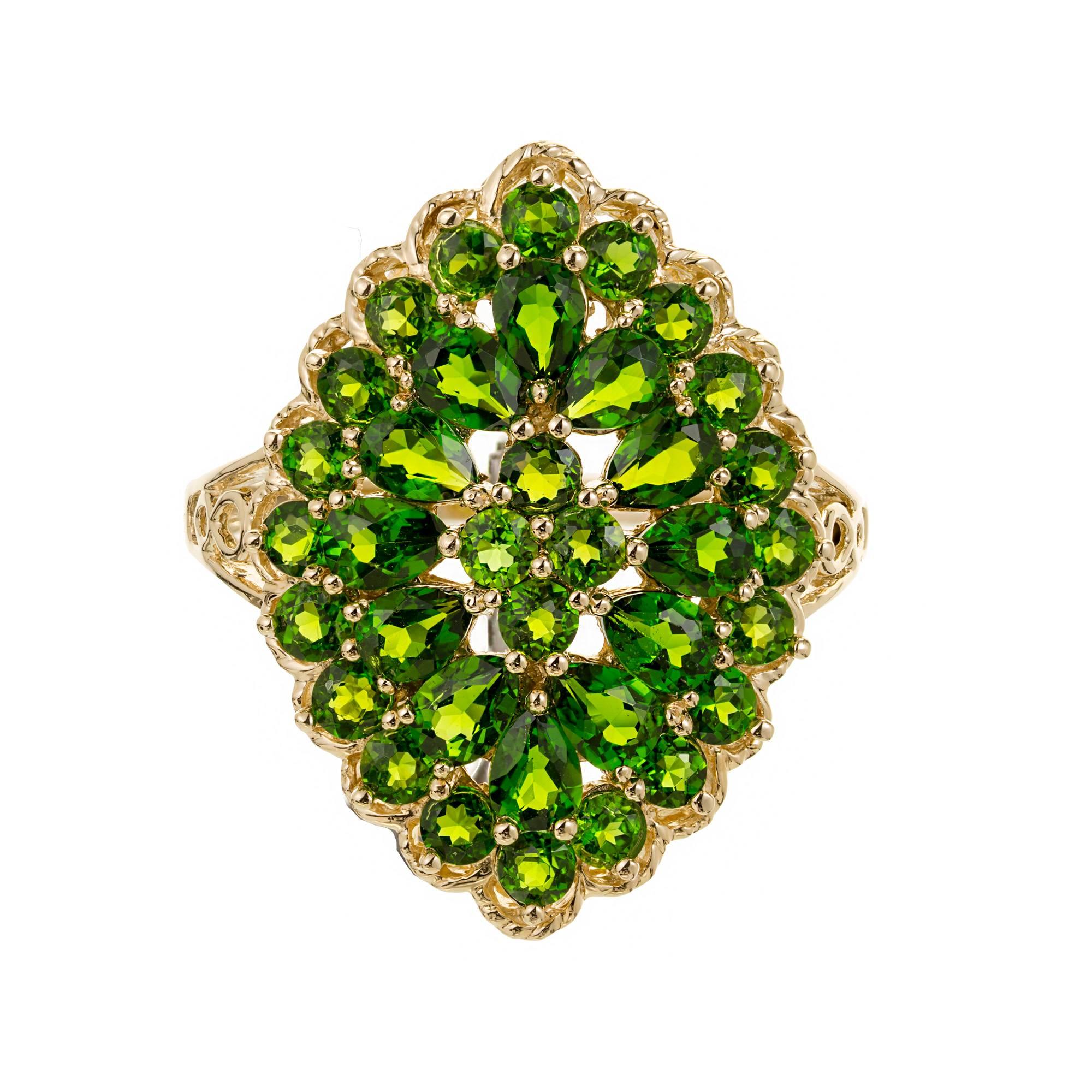 3.00 carat bright green Tsavorite garnet 14k yellow gold cluster cocktail ring. 

24 round Tsavorite green VS
12 pear shaped Tsavorite green, VS
Total of all 3.00cts
Size 4 and sizable
14k Yellow Gold
4.6 grams
Tested and Stamped: 14k
Hallmark: