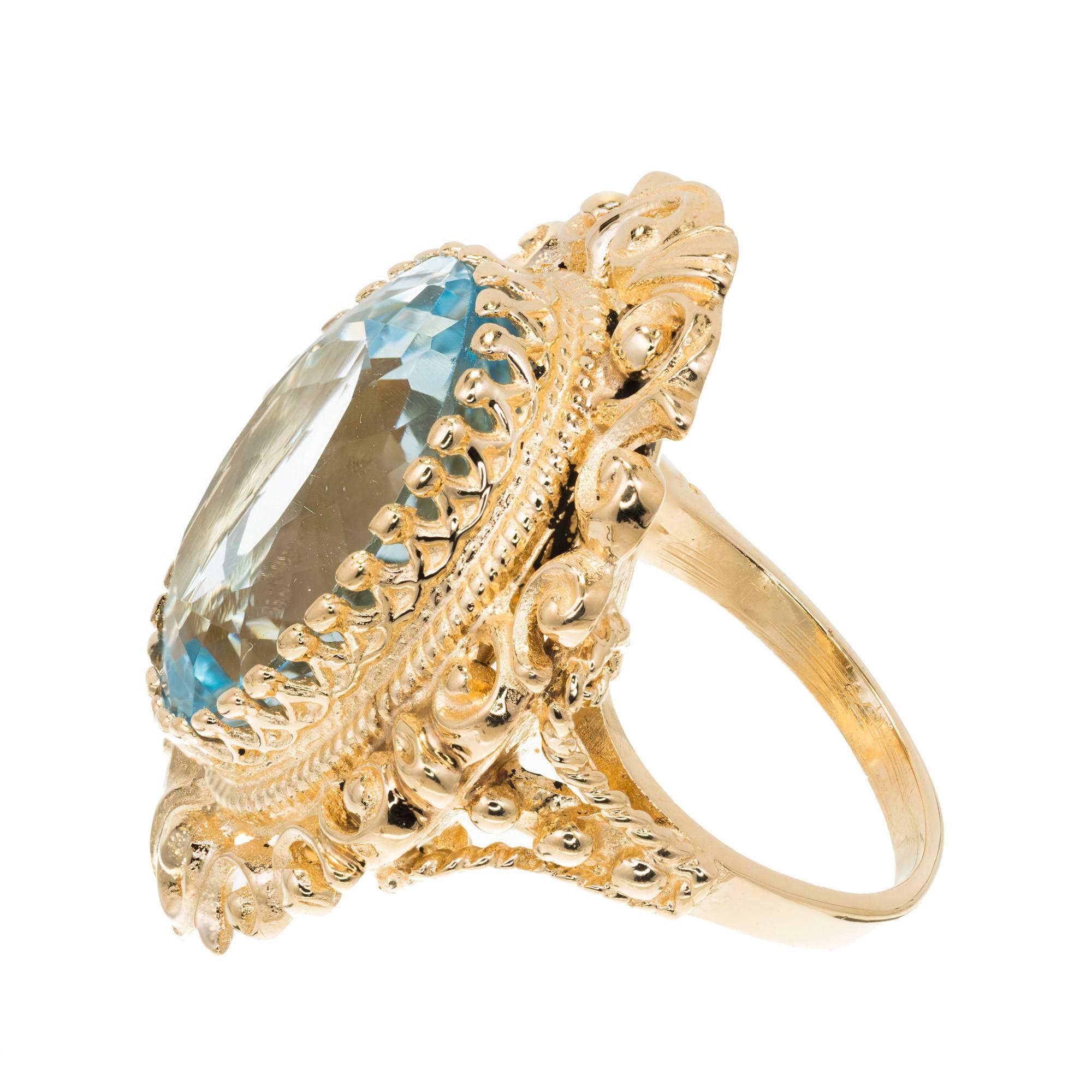 Women's 18.00 Carat Oval Bright Blue Topaz Gold Cocktail Ring For Sale