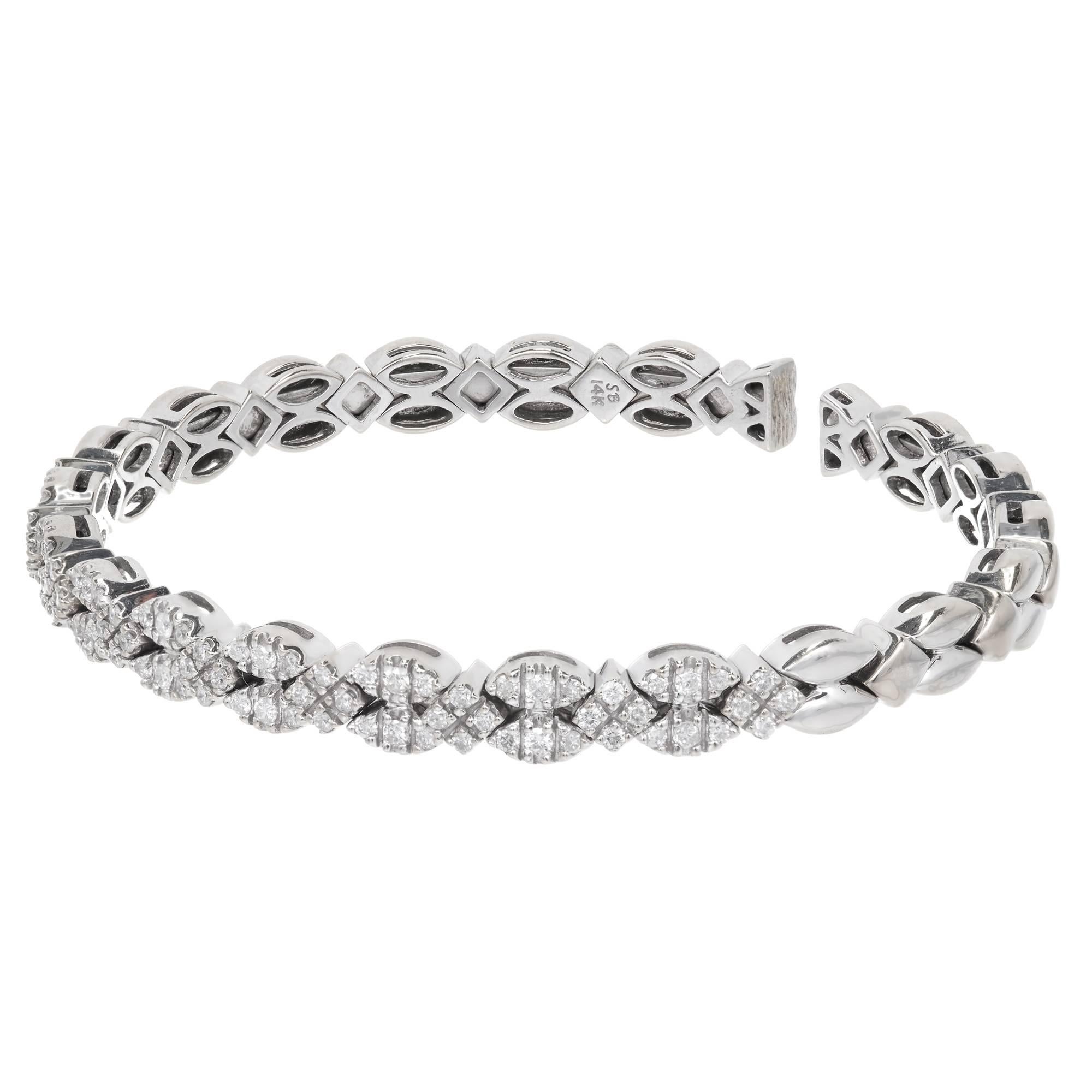 Authentic Sonia B heavy solid 14k white gold flex bangle bracelet with 1.75ct of bright white sparkly diamonds.

84 full cut diamonds approx. total weight 1.75cts, H, SI1
14k White Gold
28.3 grams
Stamped: 14k SB for Sonia B
Open bottom and oval