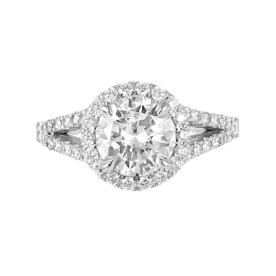 Bague de fiançailles Peter Suchy à tige fendue, diamant rond et halo en platine. Conçue pour que l'alliance soit à fleur de la monture. Diamant central certifié GIA de 1,55 ct.  

Platine
1 diamant rond, poids total approx. 1.55cts, E, VS1,