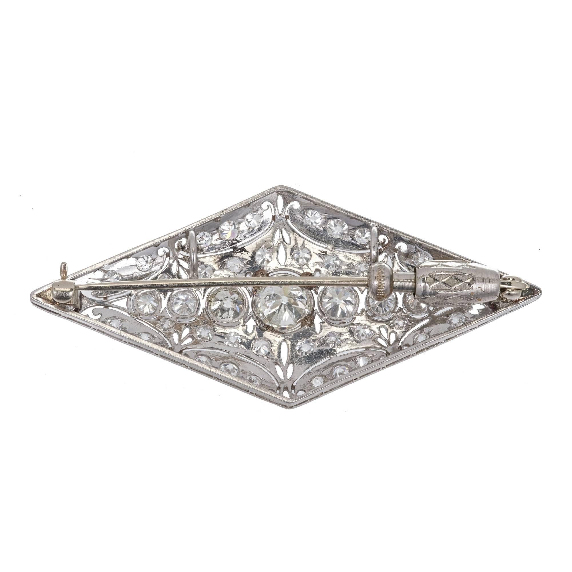 Art Deco solid Platinum and 14k white gold Diamond brooche.  All handmade set with Old European cut and transitional cut diamonds.  Beautiful hand engraving, bead setting and piercing.  The center row of diamonds are wet in delicate bezels with