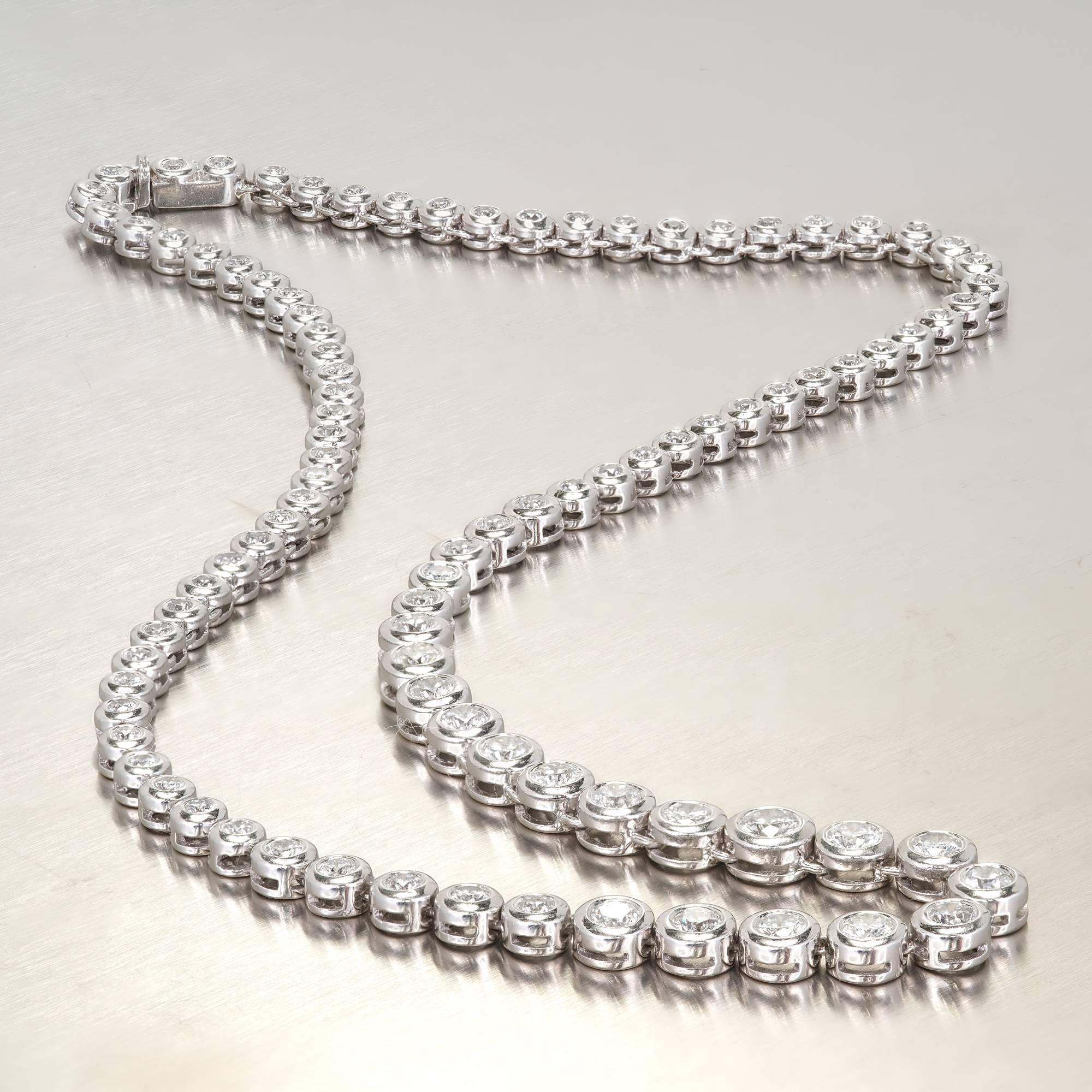 Classic solid Platinum bezel set diamond tennis necklace with well-cut H, VS to SI bright white shiny diamonds. Built in hidden catch and side lock safety.

93 diamonds, approx. total weight 7.00cts, H, VS2 to SI1
Tested: Platinum
Stamped: