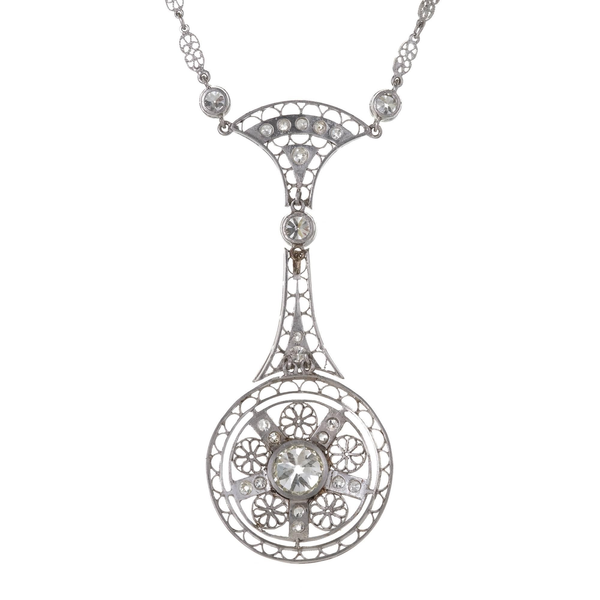 EGL certified Victorian 1900 handmade filigree drop pendant and handmade filigree chain. The diamonds are white old cut and sparkly. All original. 

1 Center diamond EGL certified .99ct, I, VS1 old European cut, excellent sparkle and brilliance,