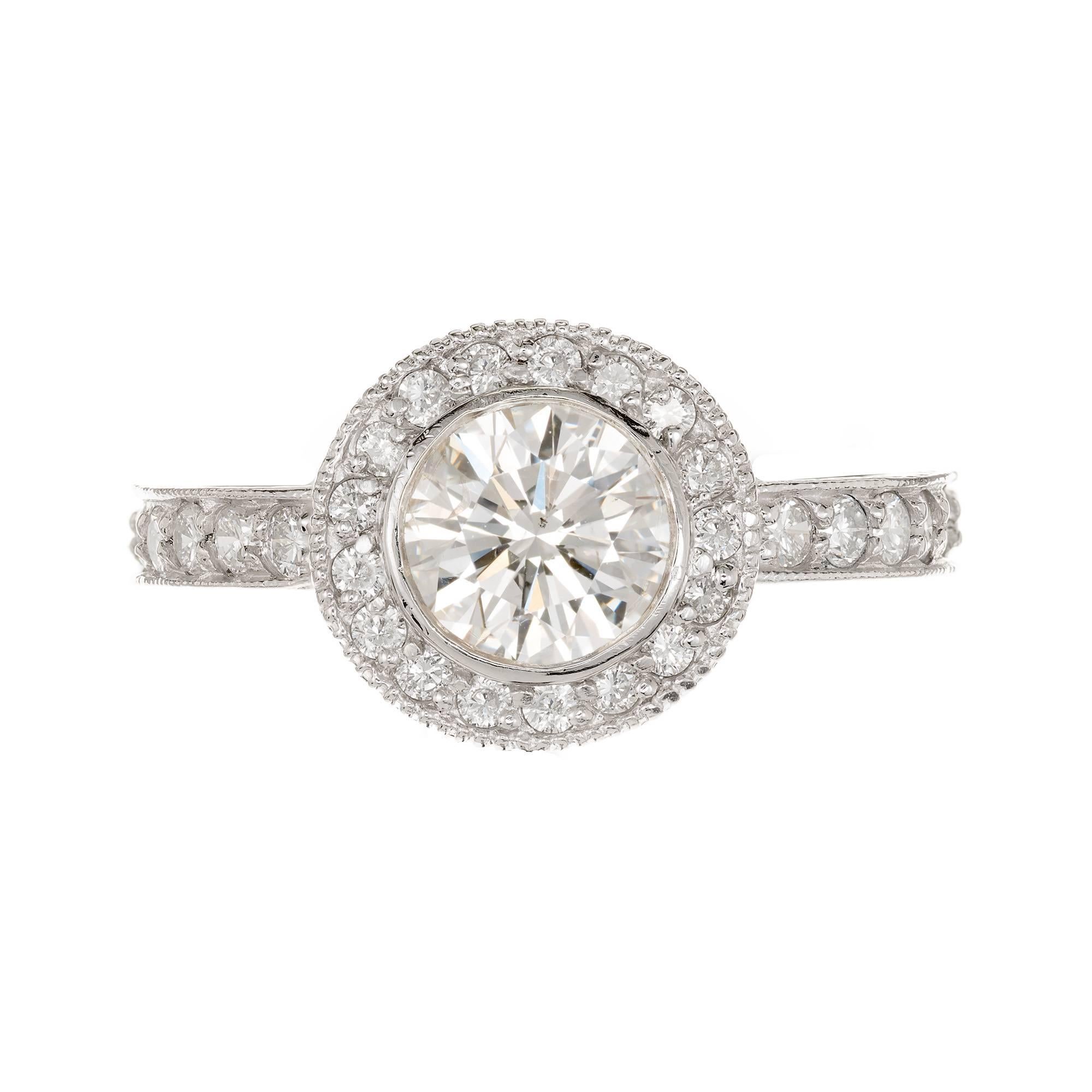 Peter Suchy Micro-pave diamond solid Platinum engagement ring. Engraving on both sides of the shank and top portion of the ring. Beaded edges on both as well. The center is set with a beautiful bright white sparkly diamond. EGL certified as H, SI2.