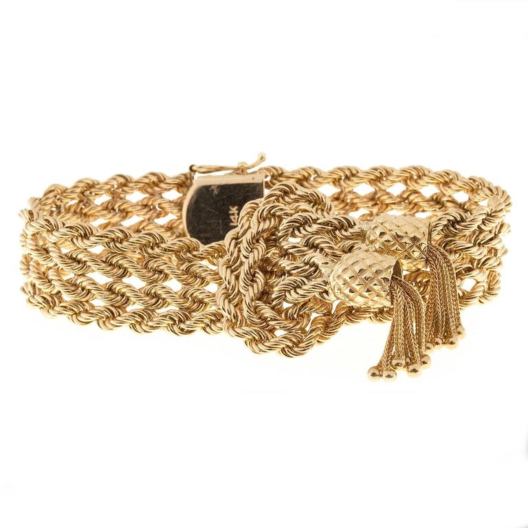 Four Row heavy solid gold Rope Double Tassel Oval Center Bracelet at