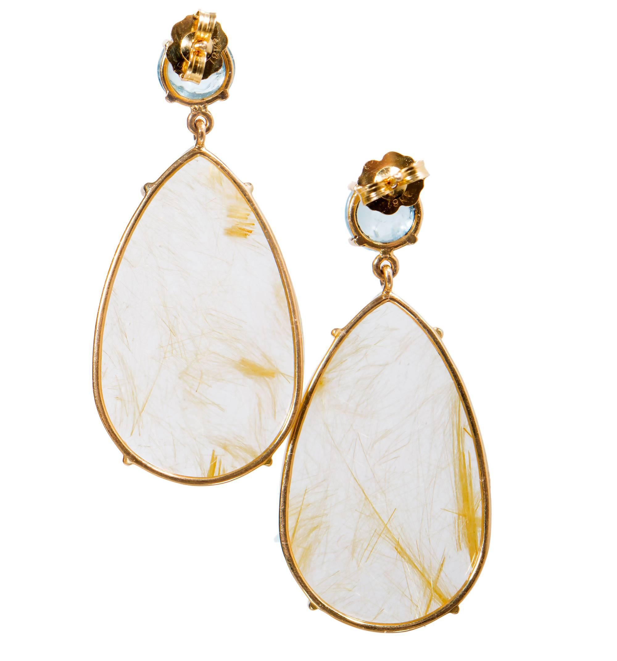 Handmade Aqua and quartz 18k yellow gold dangle earrings from the Peter Suchy Workshop.

2 round natural untreated Aqua 6.7mm cabochon, approx. total weight 2.88cts
2 pear shaped rutilated clear golden yellow Quartz 30 x 19mm, approx. total