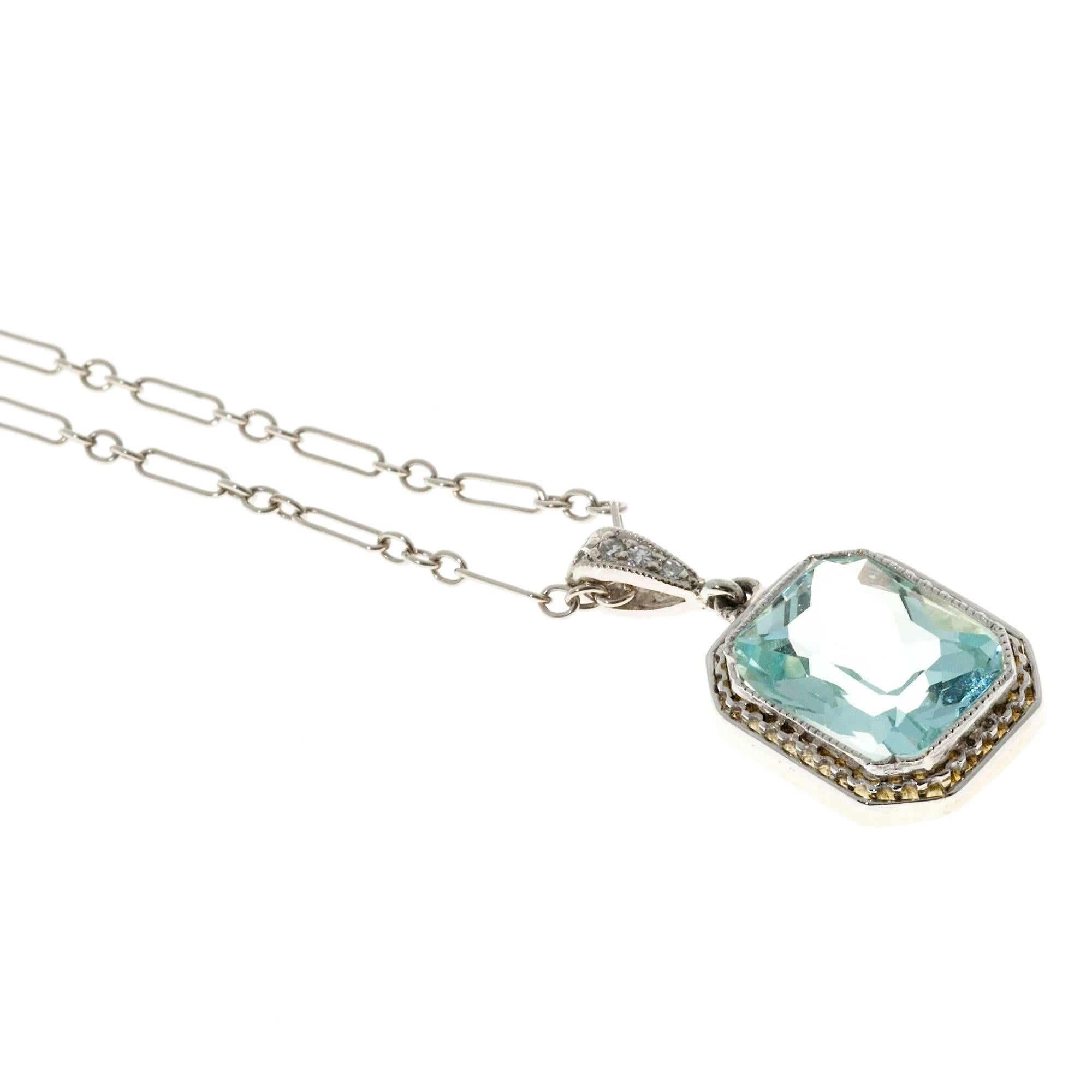 Art Deco aqua pendant necklace. Bright blue natural Aqua set in a handmade Platinum bezel and frame.  The bail and chain are 14k white gold. Original circa 1925-1930. 16 inch chain. 

1 Emerald step cut natural bright light blue Aqua, approx. total