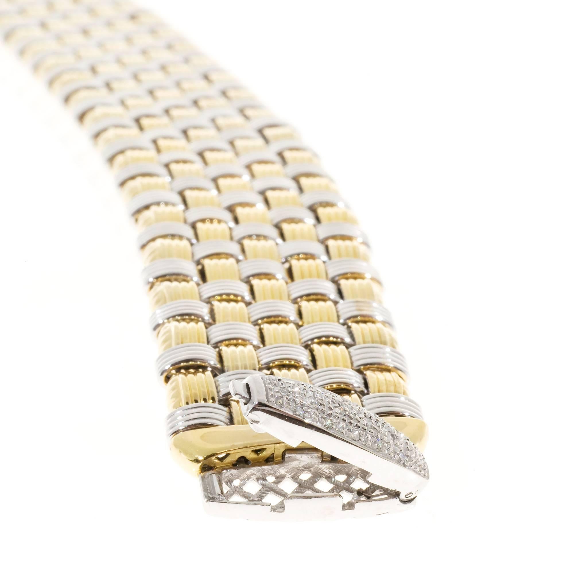 Beautiful OTC Italian 18k yellow and white gold mesh bracelet with diamond catch. Circa 1960-1970. Italian design beauty.

15 round diamonds, .01ct each, approx. total weight .15cts, H, SI1
18k yellow and white gold
Tested and stamped: