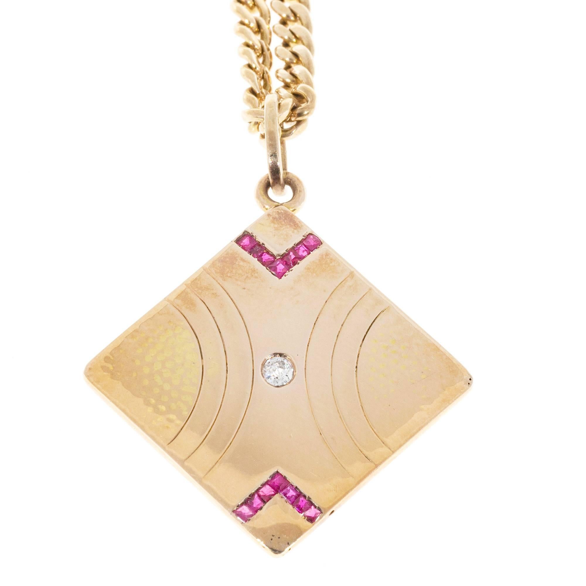 14k rose gold chain with spring ring.  17 inches long. Handmade textured and 14k pink gold pendant set with one center diamond and 10 square French cut genuine Rubies. The left and right side of the pendant are textured. Circa 1890’s.

.15cts old