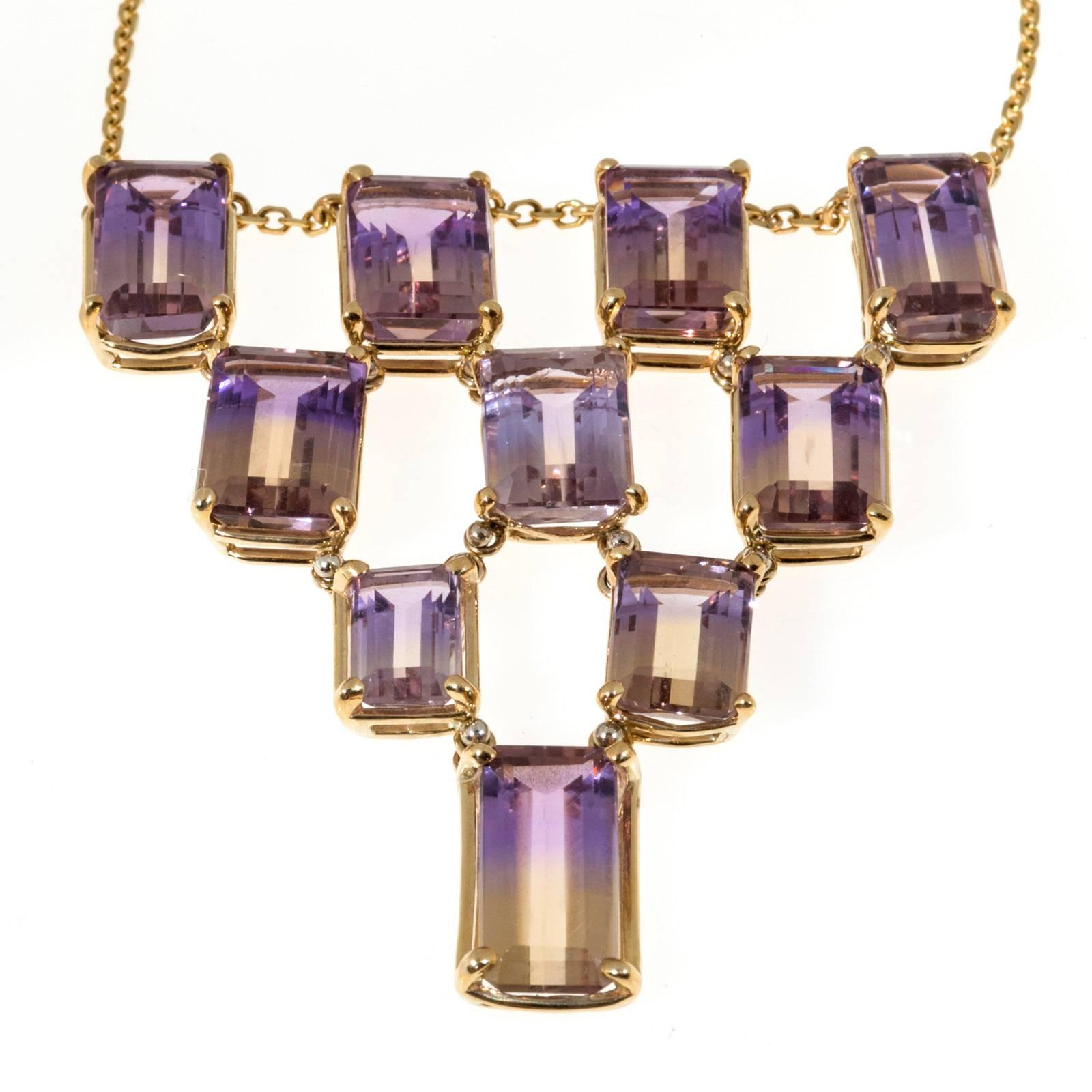 Ametrine 10 stone necklace handmade in a hinged style. 44.81cts of Ametrine. The necklace is handmade of hinged basket Art Deco style settings in the Peter Suchy Workshop.

10 emerald cut genuine Ametrine 44.81cts.
Center pendant section is