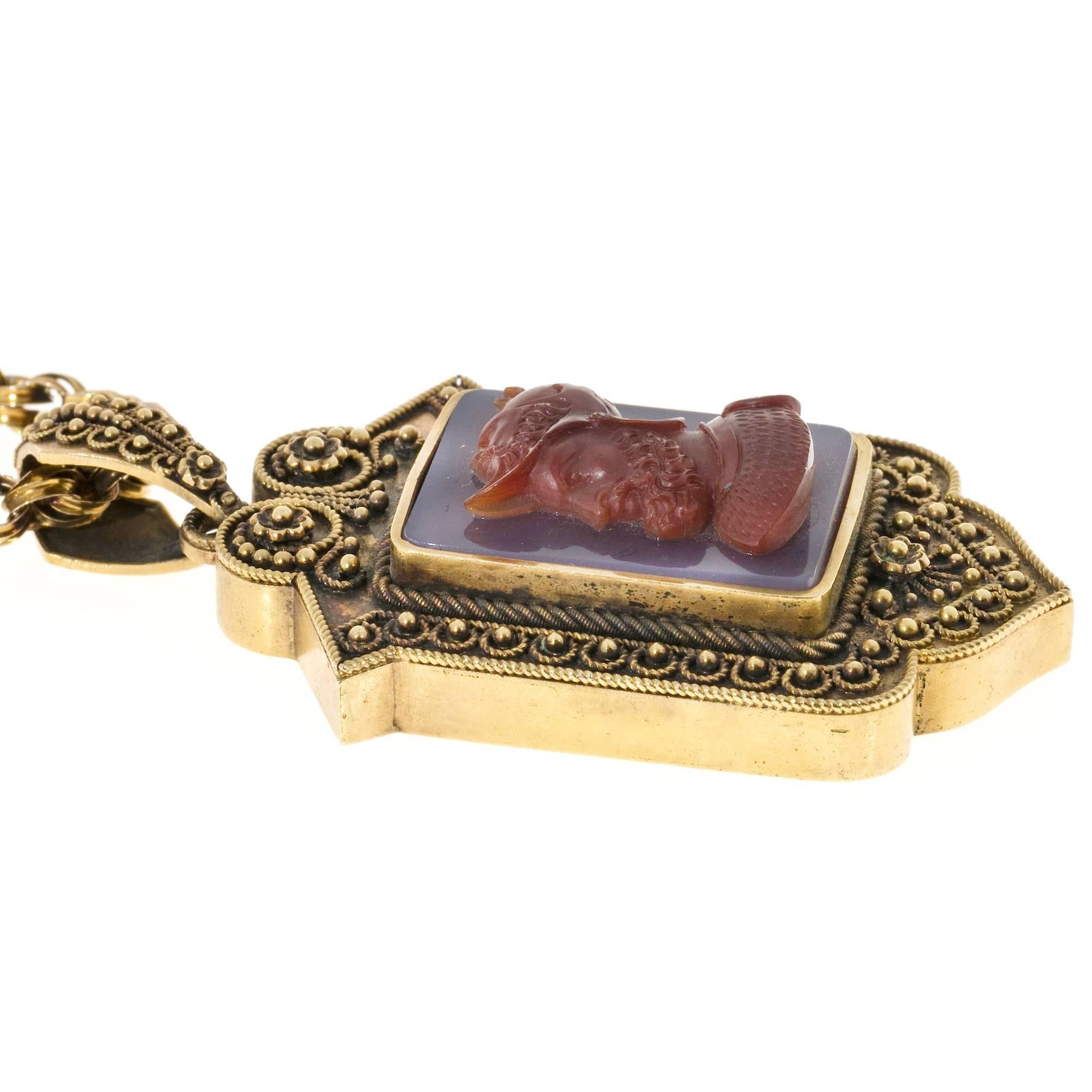 Authentic original Victorian 14k handmade granulated top gold pendant locket. The front is set with a beautiful hand carved Carnelian hardstone Cameo of a helmeted solider. Original frames backing and glass. The carving is signed Mears and with