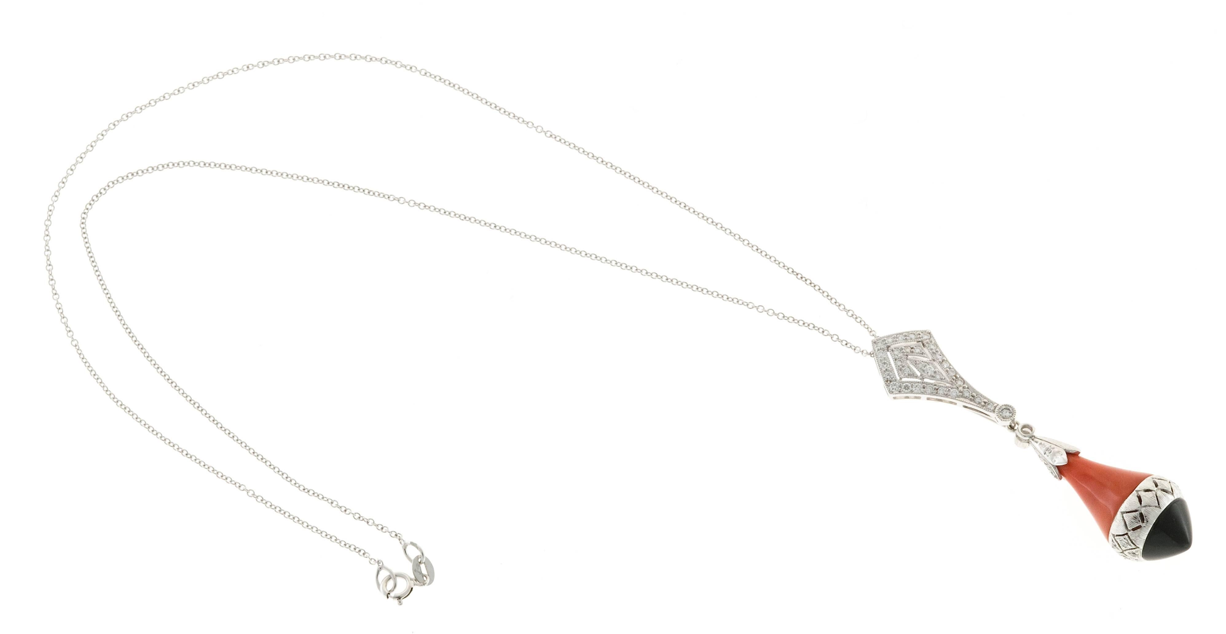 18k white gold pendant necklace. This necklace is made in two sections. The top is hand bead set with 31 full cut diamonds. The chain passes invisibly through the top of the pendant. The section can be worn by itself. It also has a hidden pendant