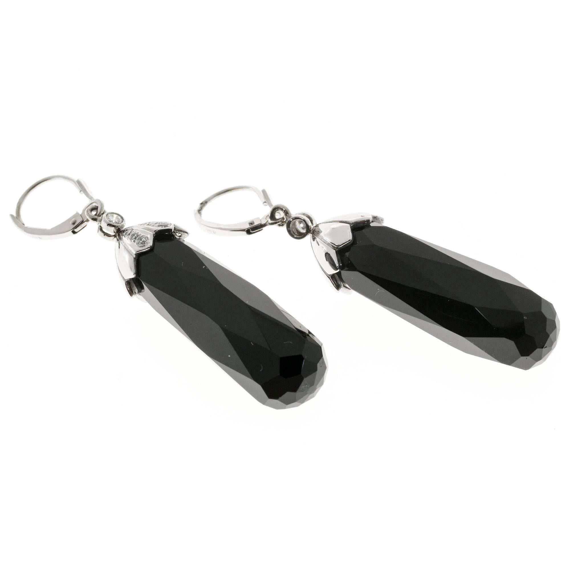 14k white gold rare faceted black Onyx diamond dangle earrings circa 1940's with large Briolette dangles. 

2 faceted black Briolette Onyx, 30 x 10.8mm
14 round diamonds, approx. total weight .10cts, VS-SI, H
14k White gold
15.1 grams
Tested