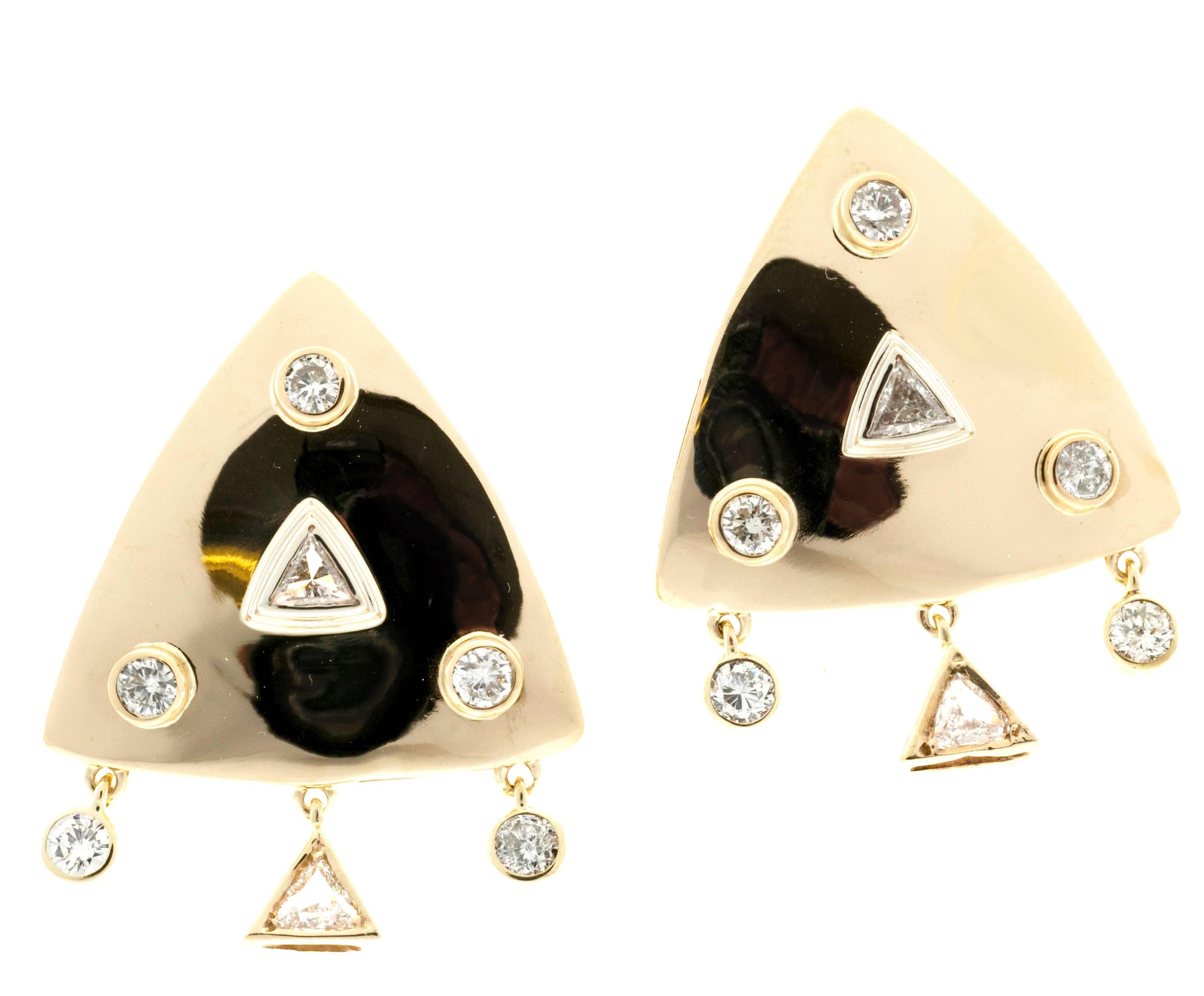1960’s handmade shiny finish with bezel set round and triangular diamonds. Pierced post and clips. The three stones on the bottom dangle. 

14 mixed diamonds approx. total weight 1.65cts, H, VS-SI1
14k Yellow Gold
Tested 14k
11.5 grams
1 1/16 x 1