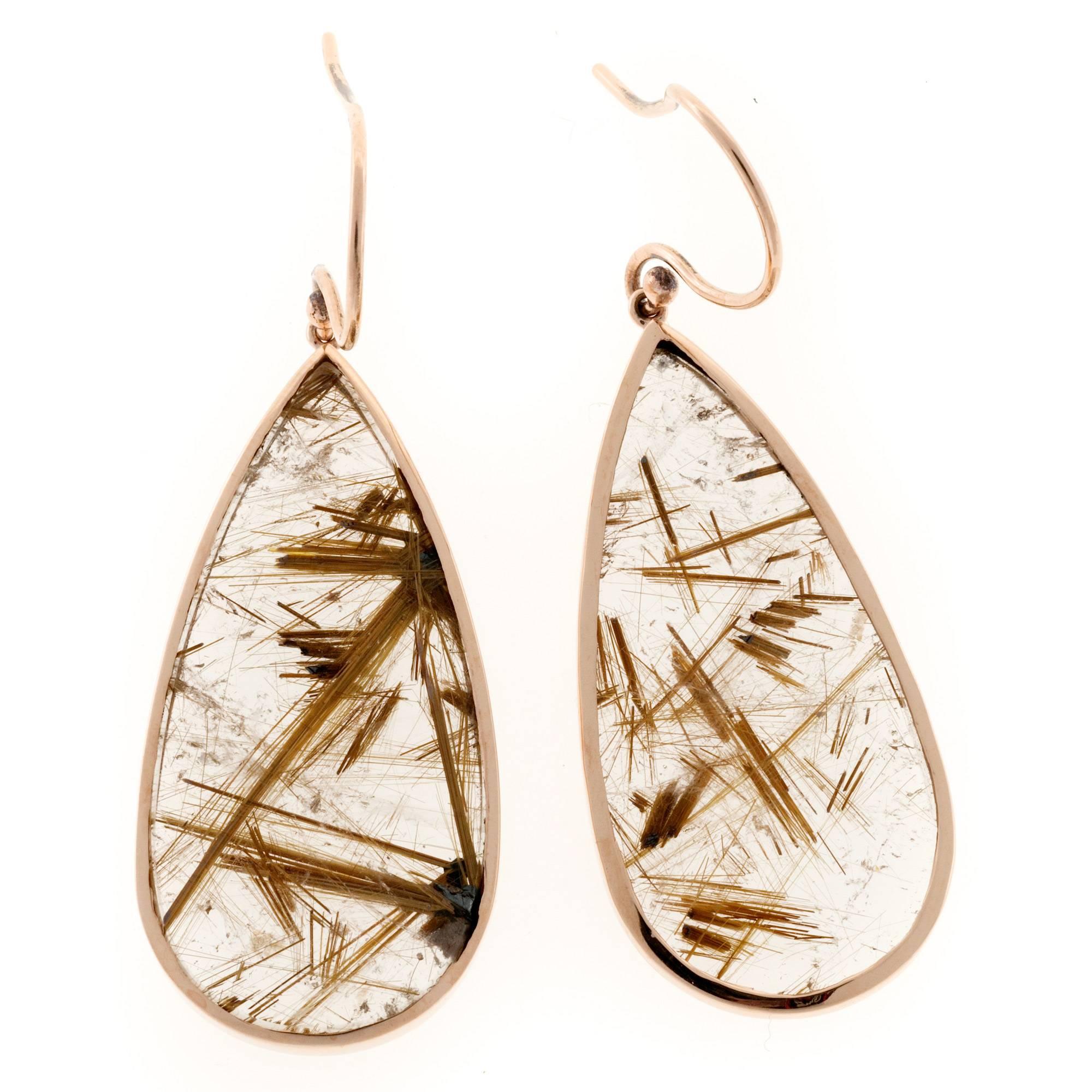 Quartz crystal dangle earrings. Pear slices with copper color bright natural inclusions. 18k rose gold frames. Crafted in the Peter Suchy Workshop.

40.66cts Quartz Chrystal
18k Rose Gold
Top to bottom: 52.62mm or 2.07 inches
Width: 18.75mm or .74