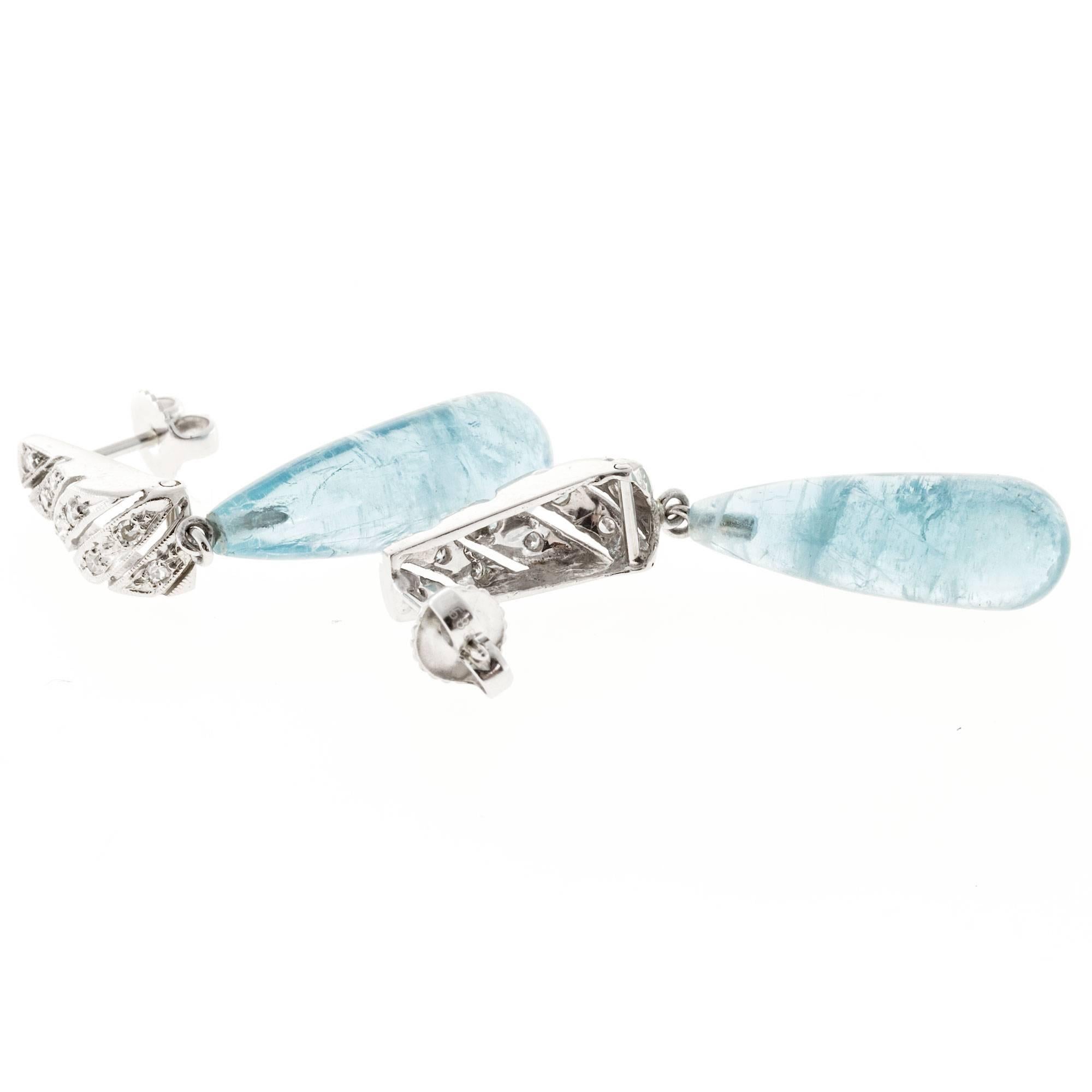 1930-1940 handmade 14k white gold earrings with pierced open work bead set tops and natural untreated Aquamarine dangles with natural inclusions and excellent natural untreated color.

2 Natural blue tear drop Aquamarine, 3D natural polished,