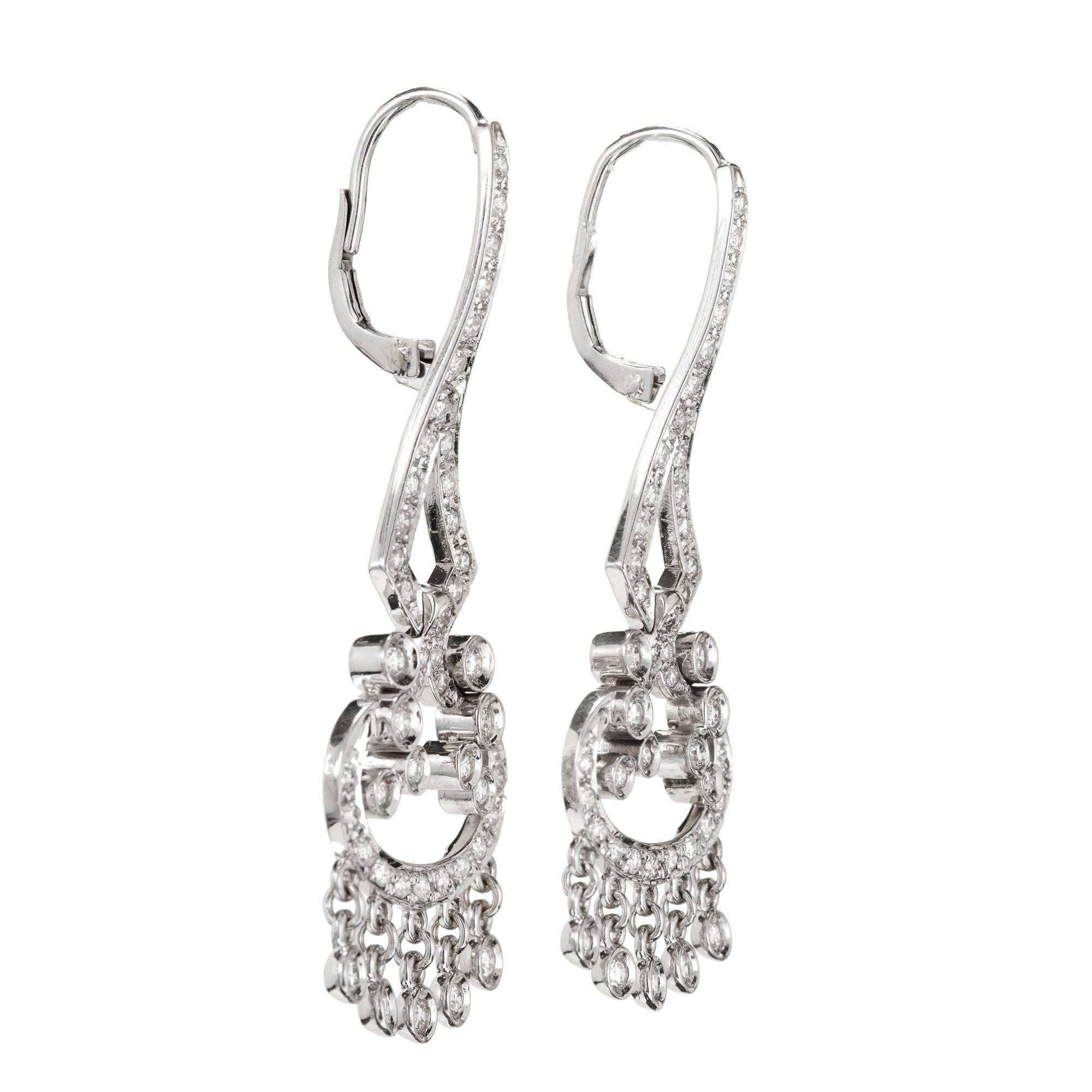 18k white gold diamond dangle chandelier style flexible earrings set with 84 all full cut diamonds. 

84 diamonds approx total weight: 1.73ct F, VS 
18k White Gold
Stamped: 18k NZ
9.4 grams
7/8 x 1 ¾ inches.