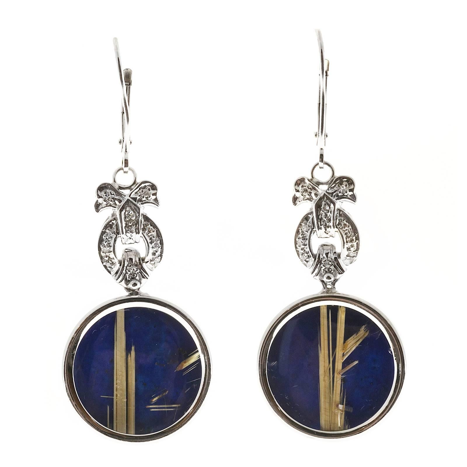 Peter Suchy Lapis 14k white gold dangle earrings. Euro wire tops bow motif.  Dangle section which is hinged at the bottom is very unique pair of genuine stones. The back layer of each stone is genuine untreated bright blue Lapis. On top of that is a