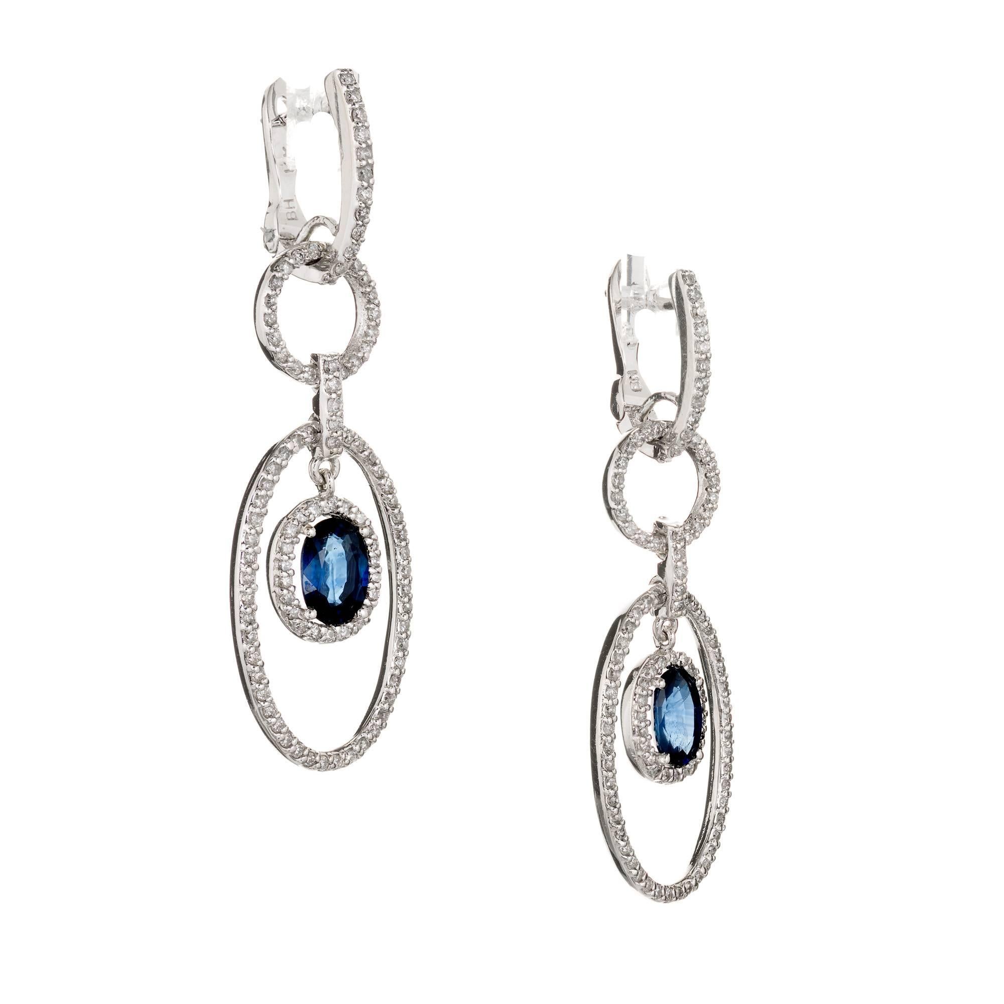 Micro common prong set. 5 section beautiful and delicate 14k white gold dangle earrings. They are set throughout with full cut white sparkly diamonds. Very little metal shows, just the diamonds. The center sections are set with a beautiful oval well