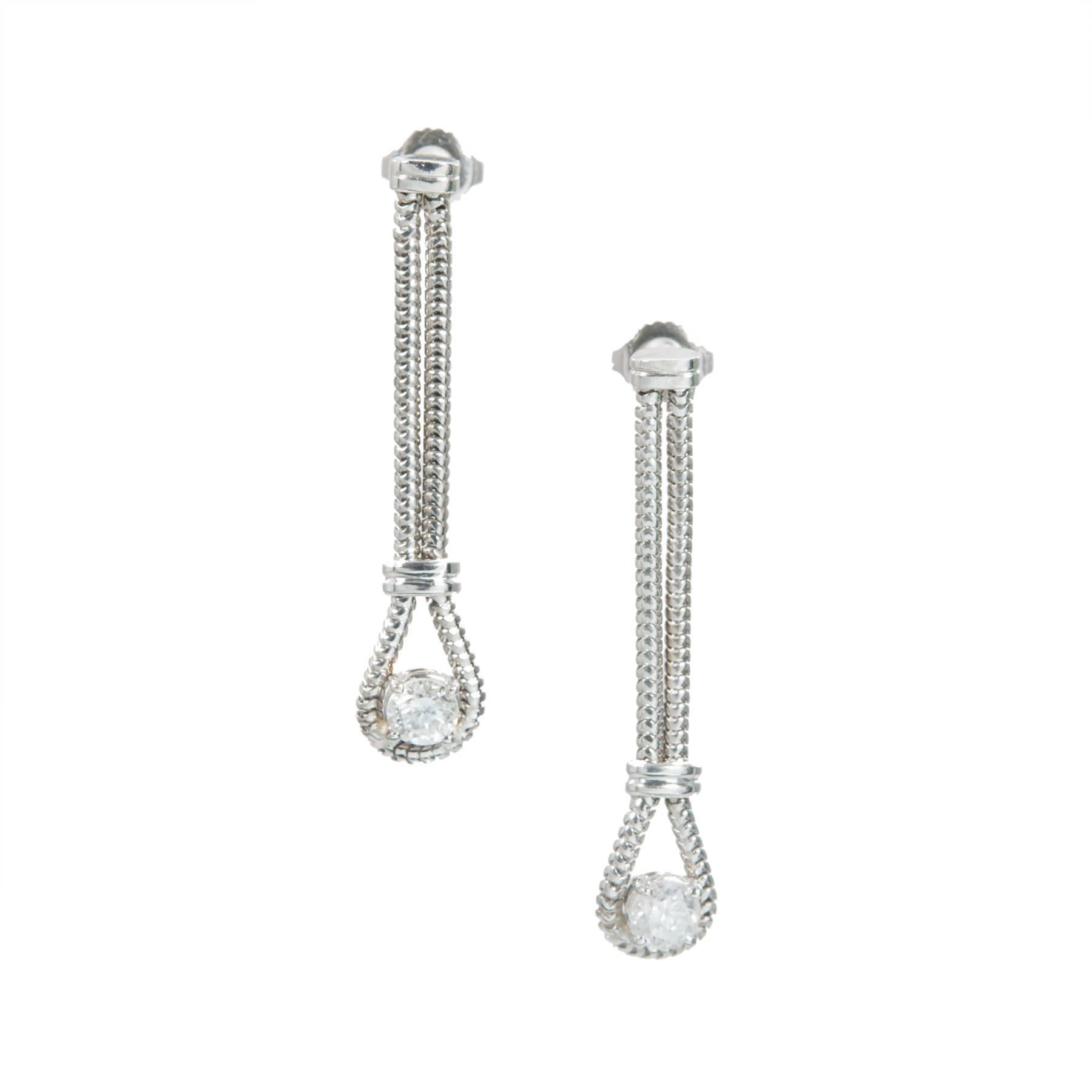 1940's late Art Deco handmade diamond dangle earrings approx. 1 1/2 inch long on 2 rows of handmade round snake chain. Post style tops. Brilliant cut diamond dangles, approx. .37ct each. 

2 round brilliant cut diamonds, approx. total weight .73cts,