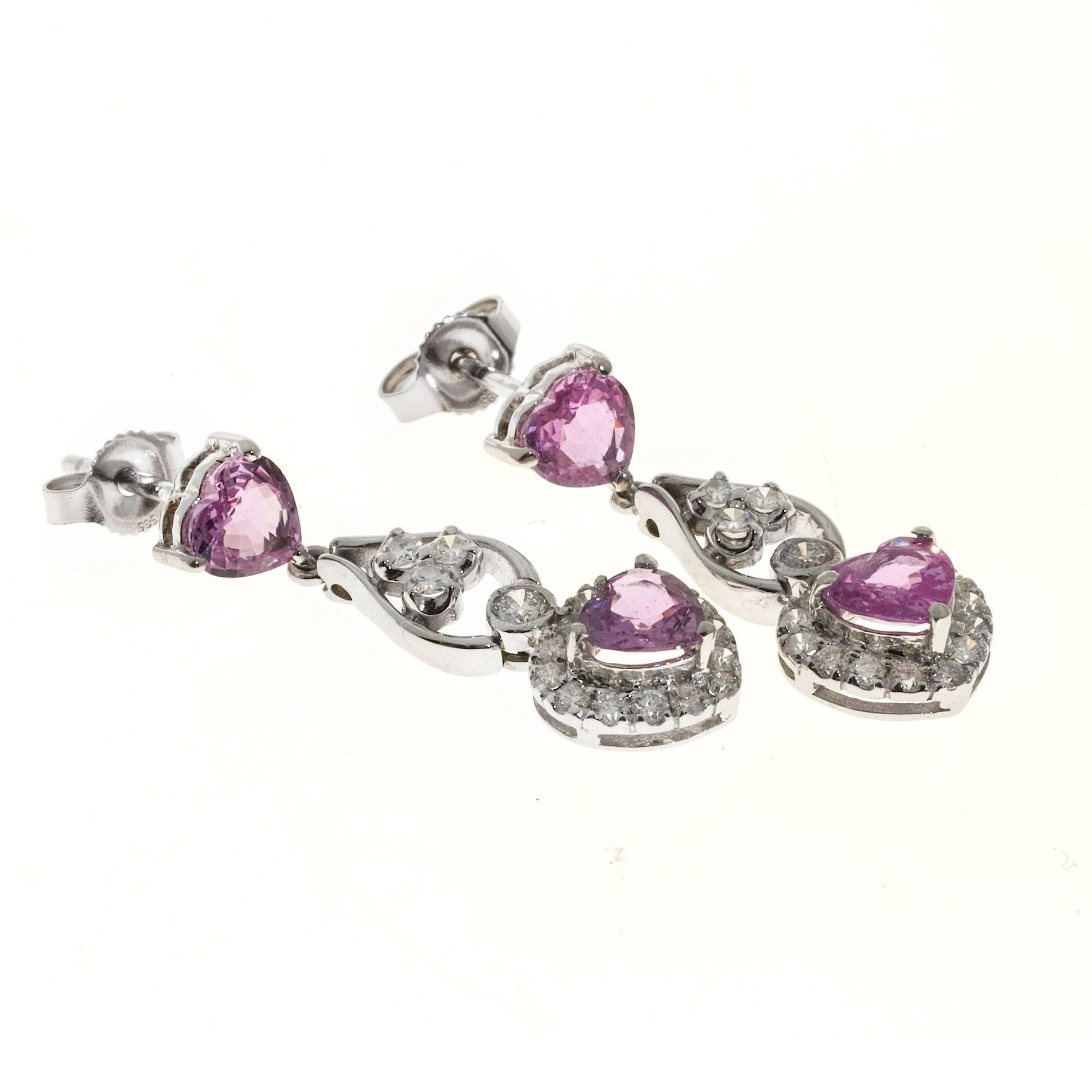 Bubble gum pink Sapphire diamond heart shaped dangle earrings. 
Simple heat only.

4 heart shaped pink Sapphires, approx. total weight 2.30cts, natural color simple heat only GIA certificate # 5151274172
36 round diamonds, approx. total weight