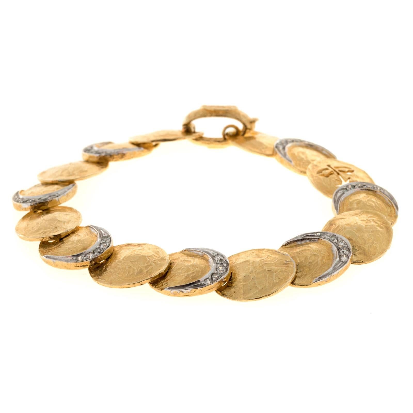 Textured link Torrini Italian 14k gold designer bracelet with diamond accents.

35 round diamonds approx. total weight .40cts, H, SI
14k Yellow Gold
Tested: 14k 
Stamped: Torrini Made in Italy
22.7 grams
7 inches long
Just under 1/2 inch