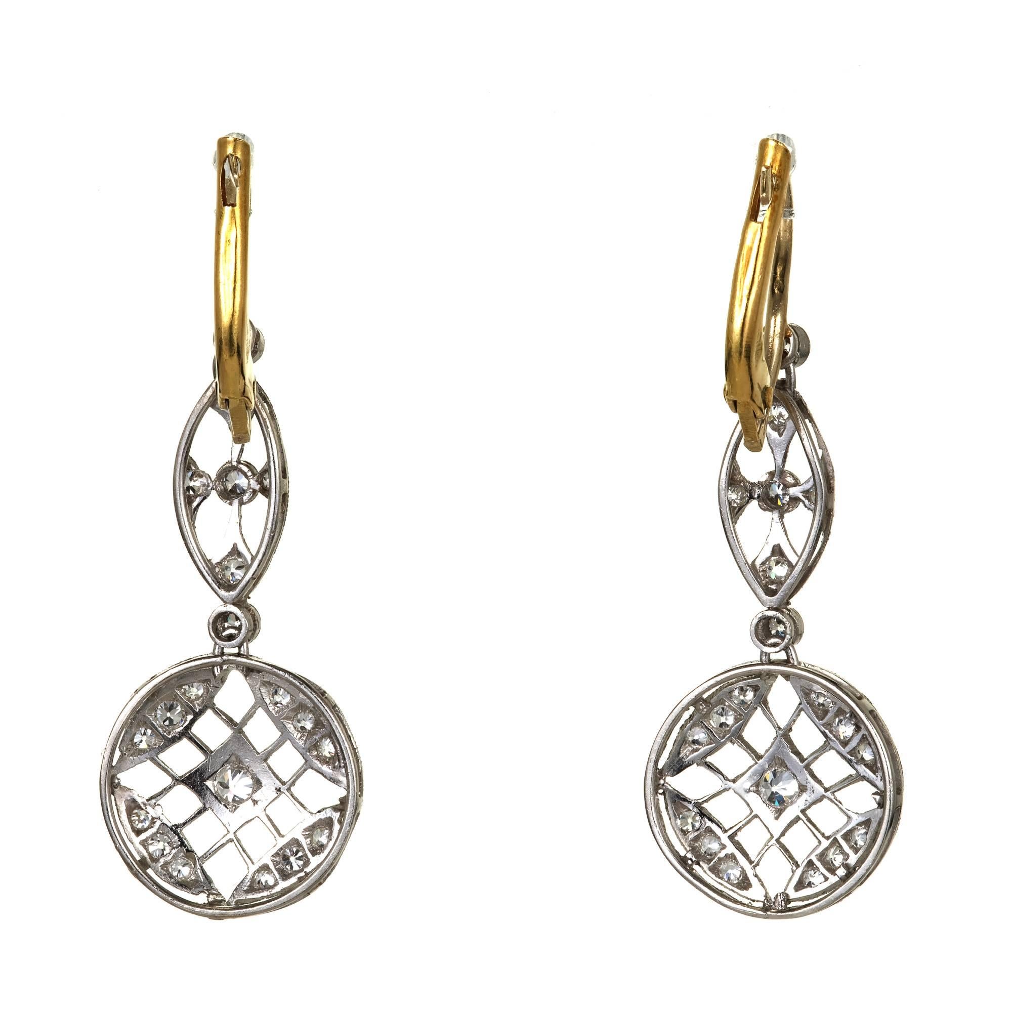 Handmade Art Deco diamond platinum dangle earrings with 14k yellow gold European style wires on top. Piercing and bead setting. Circa 1920.

44 round diamonds approx. total weight .50cts, old European cut, G, VS
Platinum
14k Yellow Gold
Tested 14k /