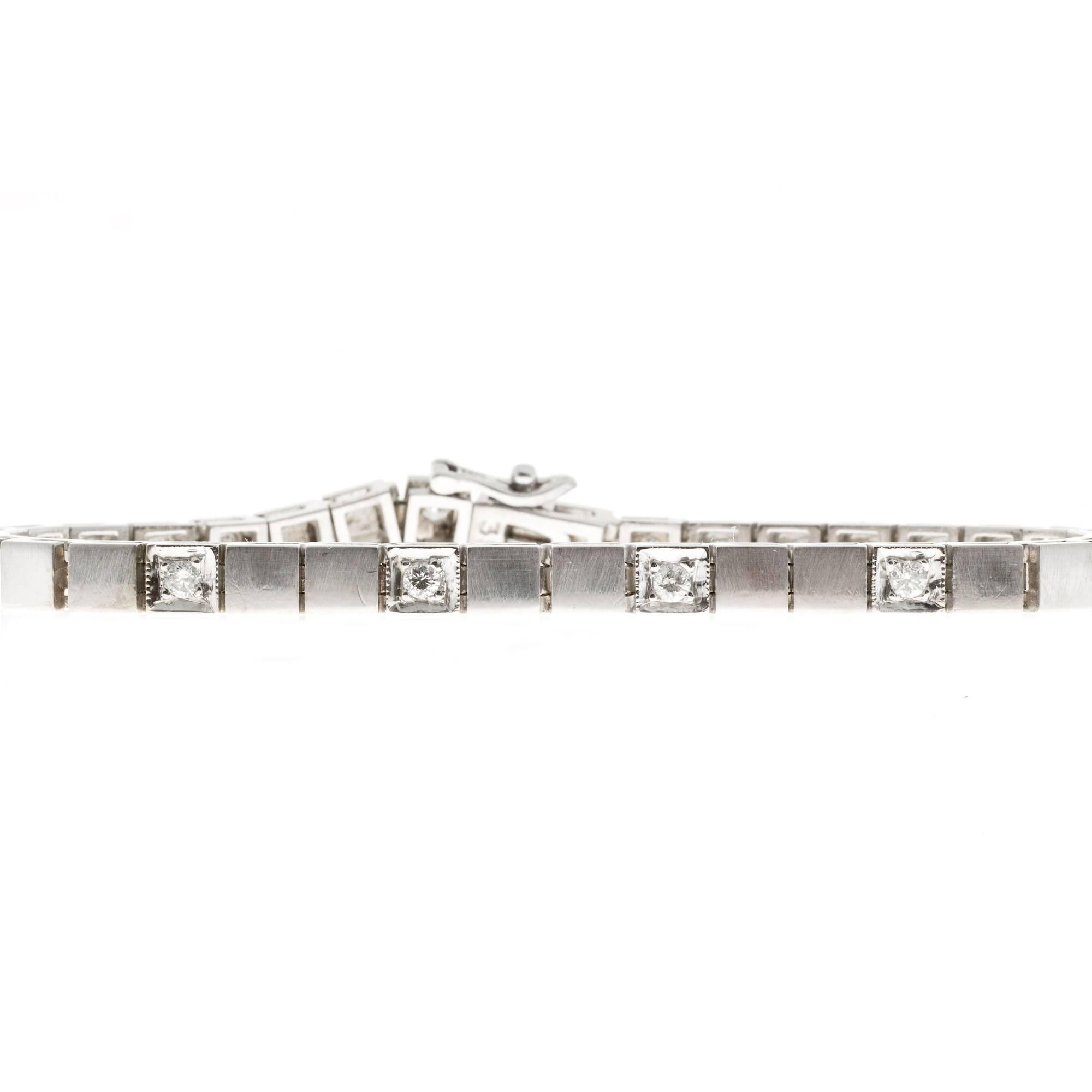 Hinged box link bracelet set every third link bead set with a bright sparkly full cut diamond. The tops of the links are brush finish. Circa 1950.

12 round full cut diamonds, approx. total weight .75cts, H, SI1
14k white gold
23.3 grams
Tested