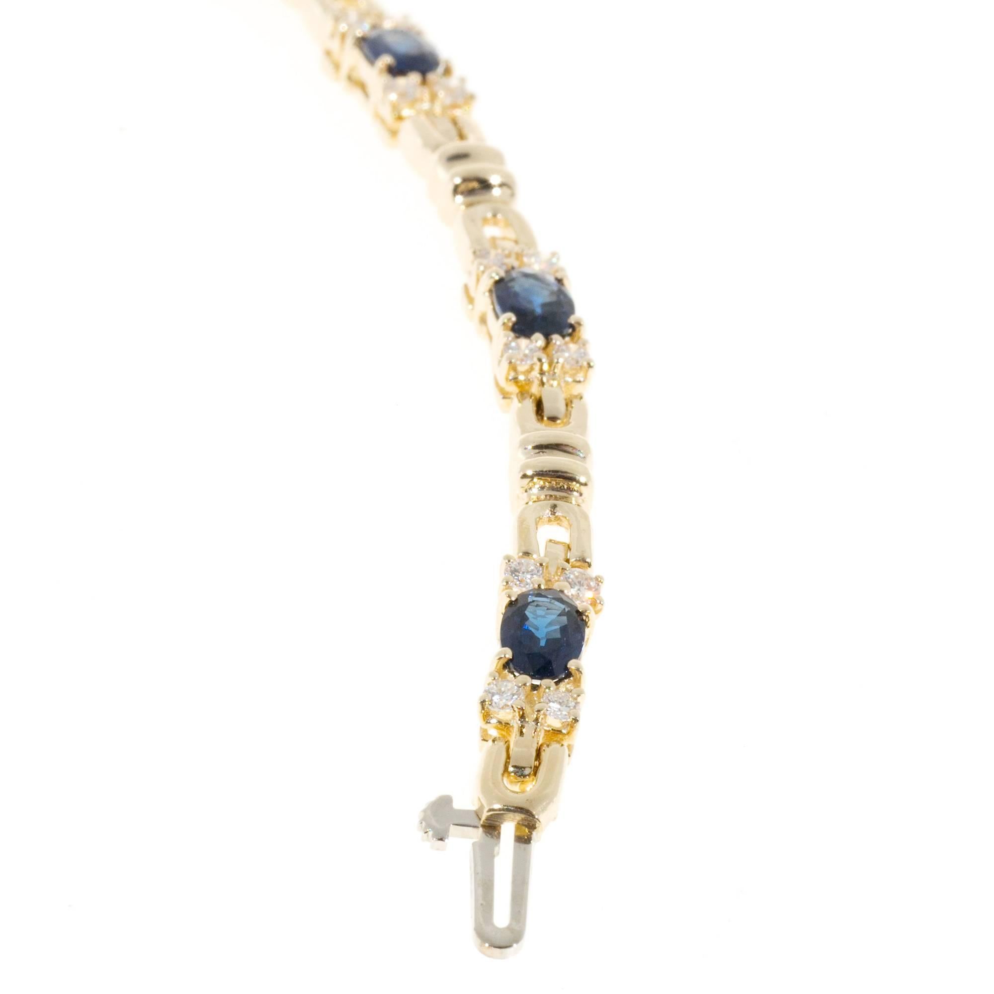 Cornflower blue Sapphire diamond 14k yellow gold hinged link bracelet.

7 bright blue oval Sapphire, approx. total weight 4.20cts, VS, 5.7 x 6.3mm, natural color and simple heat only
28 full cut diamonds, approx. total weight .70cts, H to I, VS2