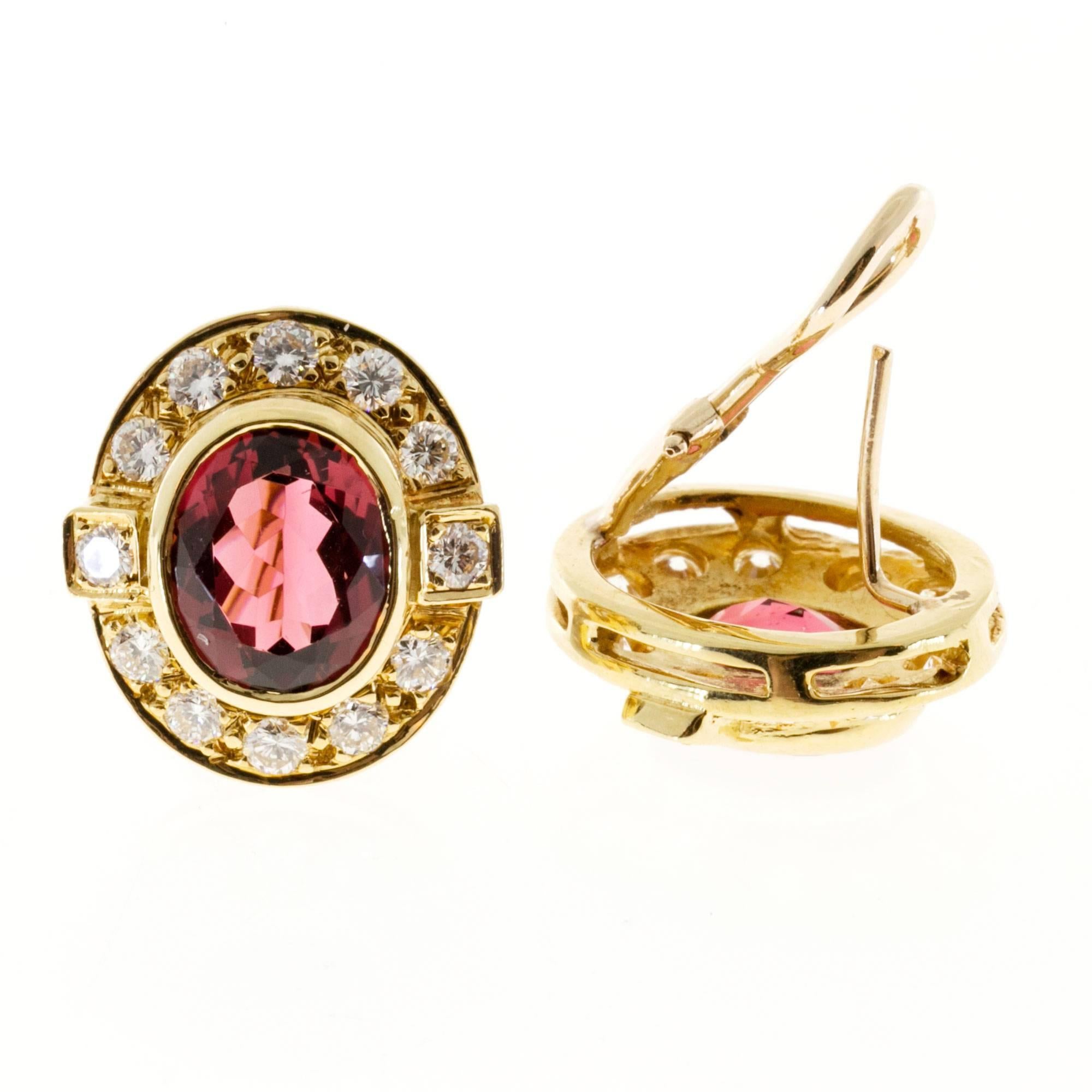 Bright oval pink Tourmalines set in a beautiful 14k yellow gold clip post earrings with excellent full cut diamonds.

2 oval genuine natural pink Tourmaline, approx. total weight 6.00ct, 10 x 8.5mm
24 full cut diamonds approx. total weight