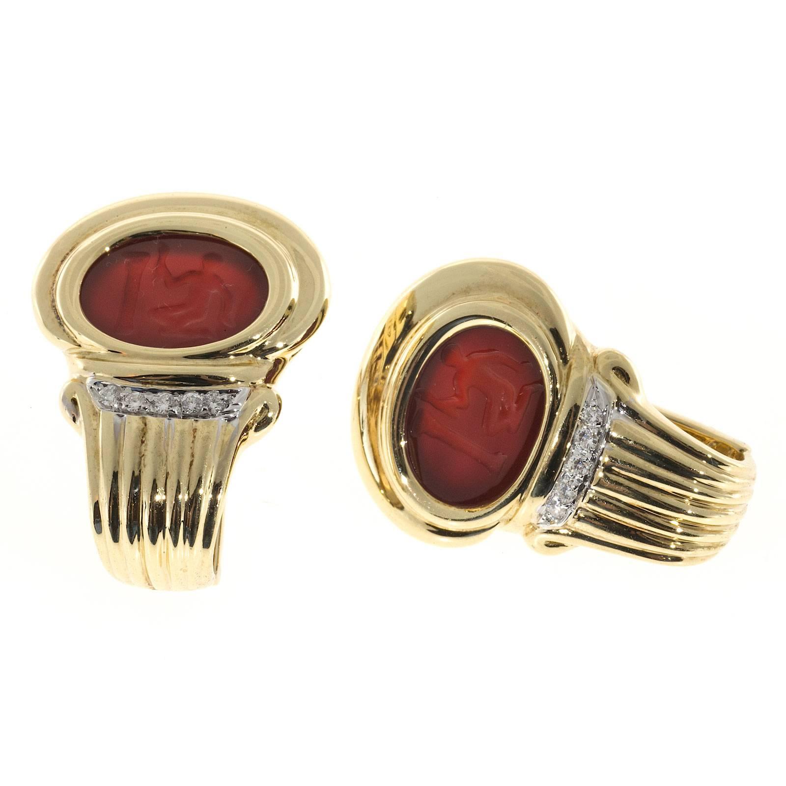 Italian carved rich red color Carnelian hard stones with diamonds in a white gold strip. Solid 18k heavy secure clip post earrings.

10 full cut diamonds approx. total weight .15cts, F, VS
2 15X11mm carved Carnelian hard stones
18k Yellow