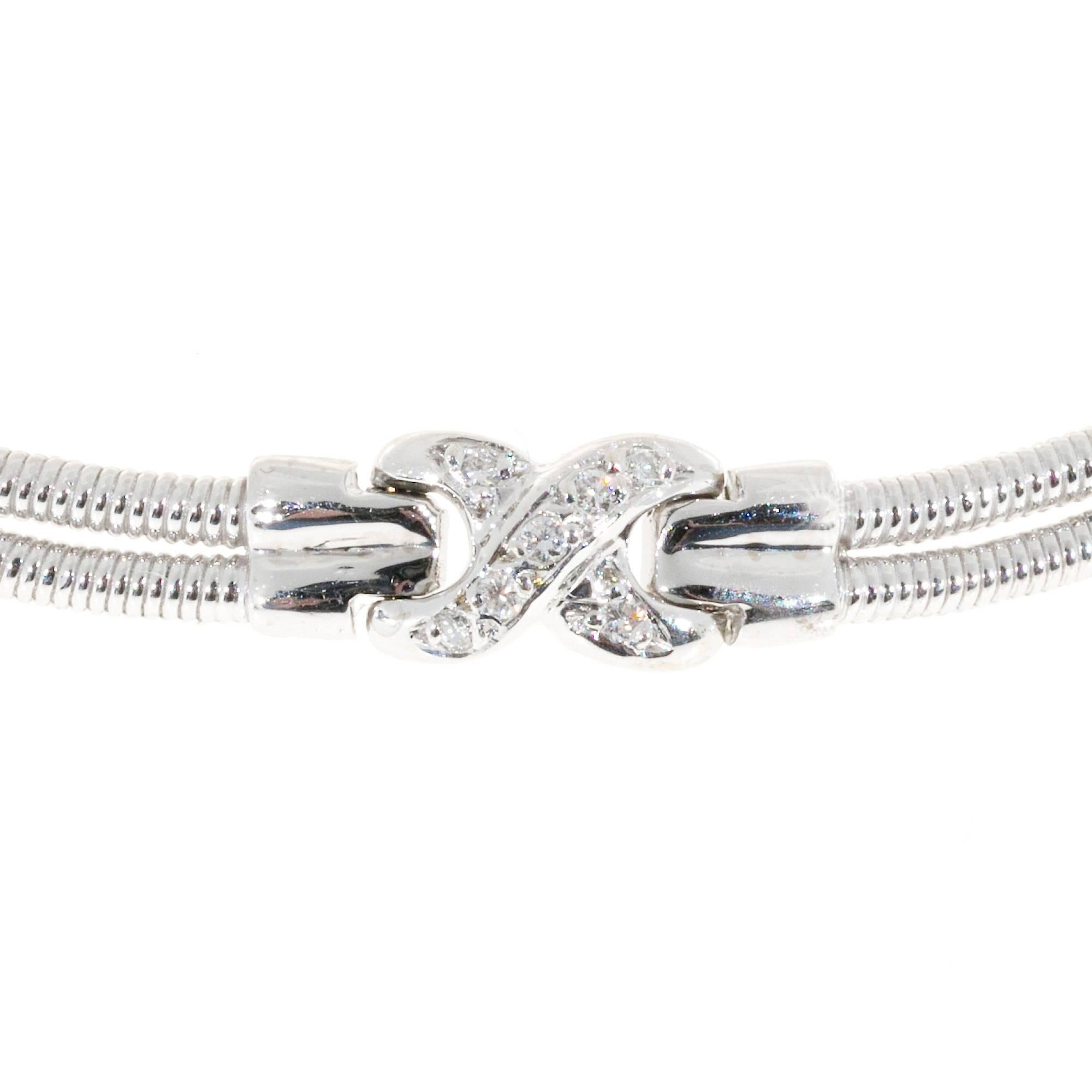 Solid 14k white gold 2 row twisted wire necklace. The hinged sections are separated by 