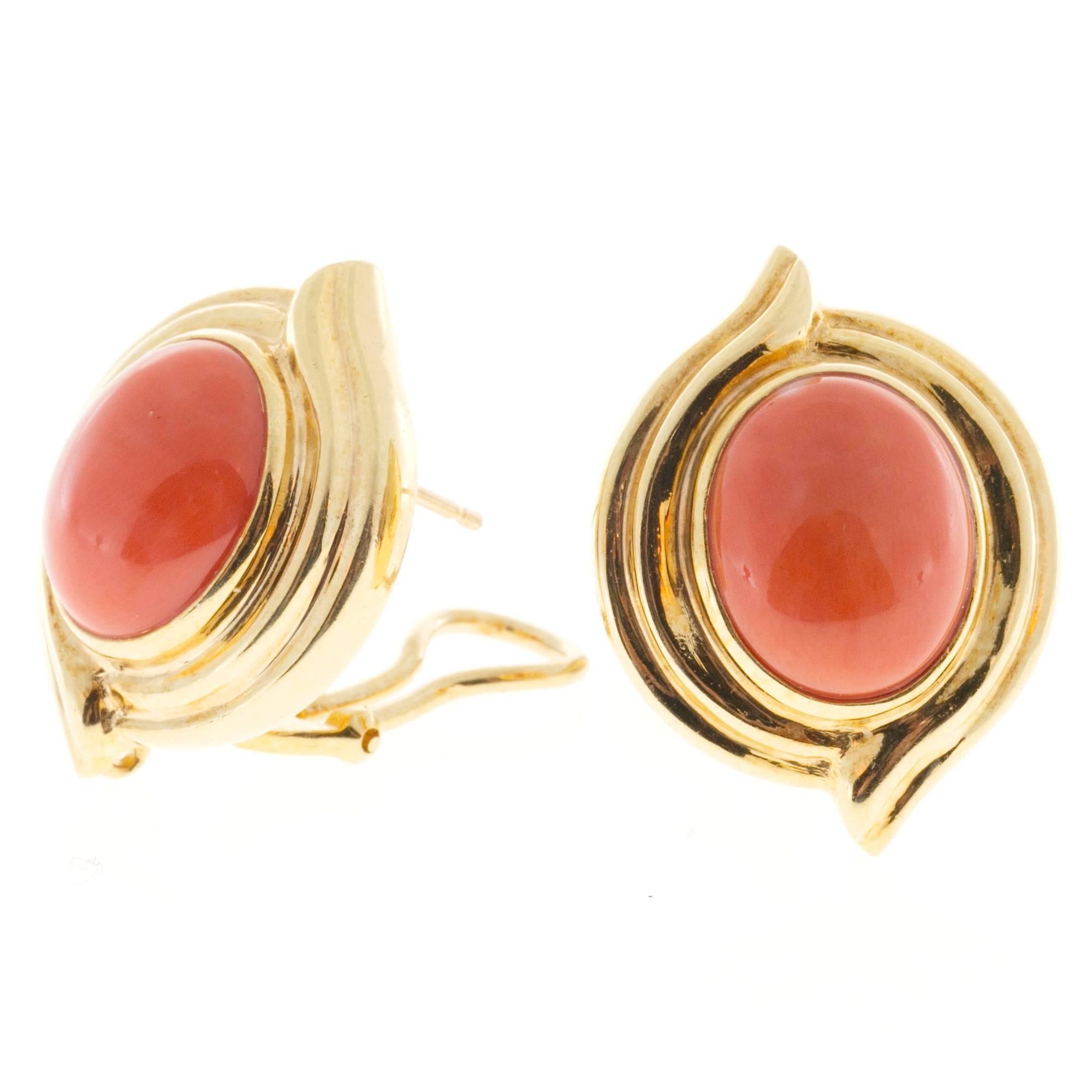 Certified natural reddish orange high polish untreated Coral in solid 18k earrings. Circa 1950-1960.

GIA certificate #2135868875 reddish orange top gem well-polished natural undyed Coral. No enhancements 13.25 x 10.85 x 5mm
18k Yellow