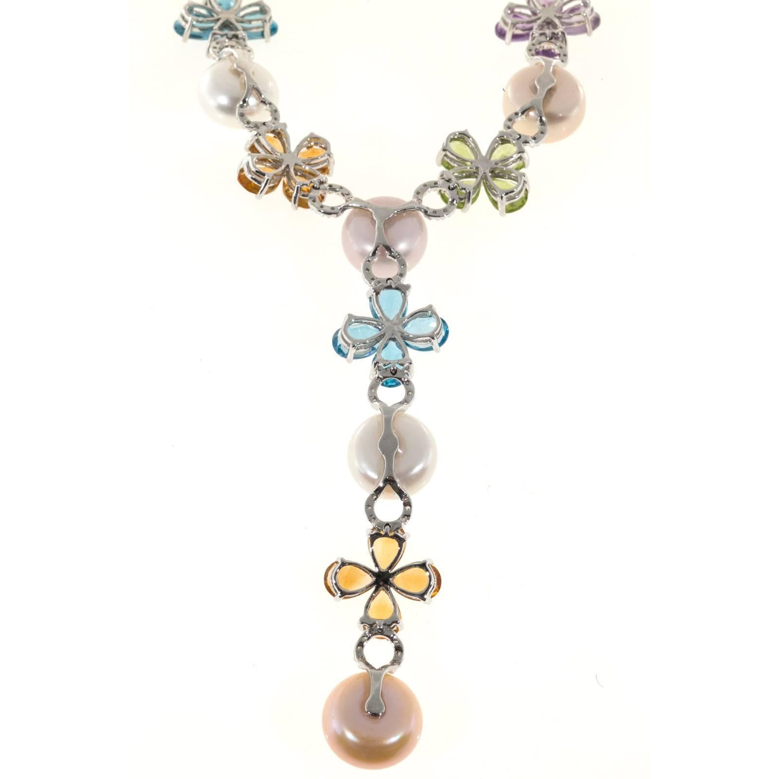 Necklace with brightly colored pear shaped genuine stones and multi-color pearls in 14k white gold.

16 multi-color button pearls 11.5mm
12 pear shaped Peridot 7 x 5mm, approx. total weight 8.40cts
12 pear shaped Citrine, 7 x 5mm, approx. total