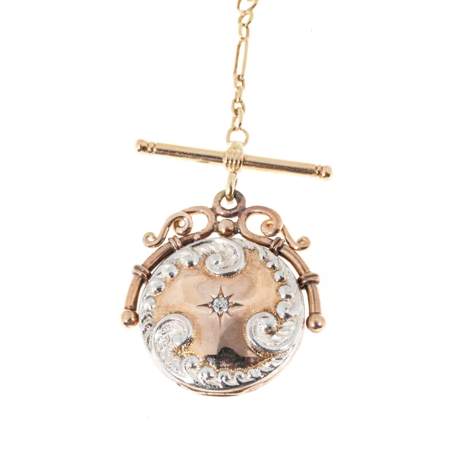 1890’s toggle style rose gold necklace. Handmade pink gold locket with Platinum topped scroll work and an old mine diamond. 

1 round diamond approx. total weight .03cts
14k Rose Gold
Stamped 14k
15.7 grams
Chain: 16 inches
Locket: 1 1/8 x 1