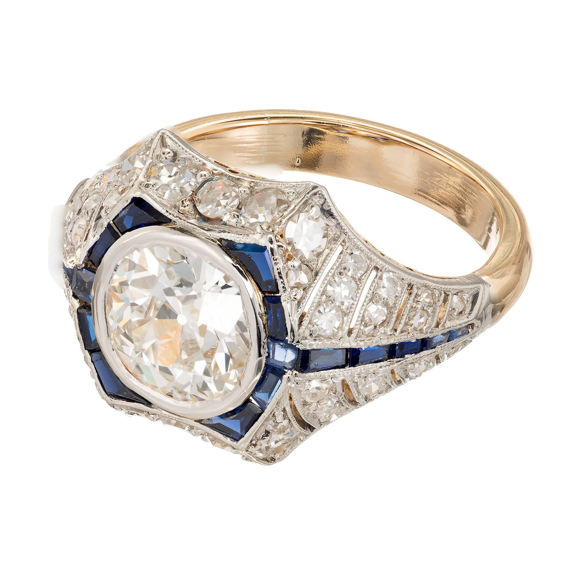 Diamond and sapphire 18k yellow gold engagement ring with handmade Platinum top set with calibre Sapphires and round diamonds. Certified and graded by the EGL. 

1 EGL USA certified US53678502D Ideal old European cut 1.65ct diamond, H, SI1, Table