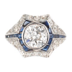Anillo de compromiso de oro y platino con zafiro y diamantes de 1,65 quilates
