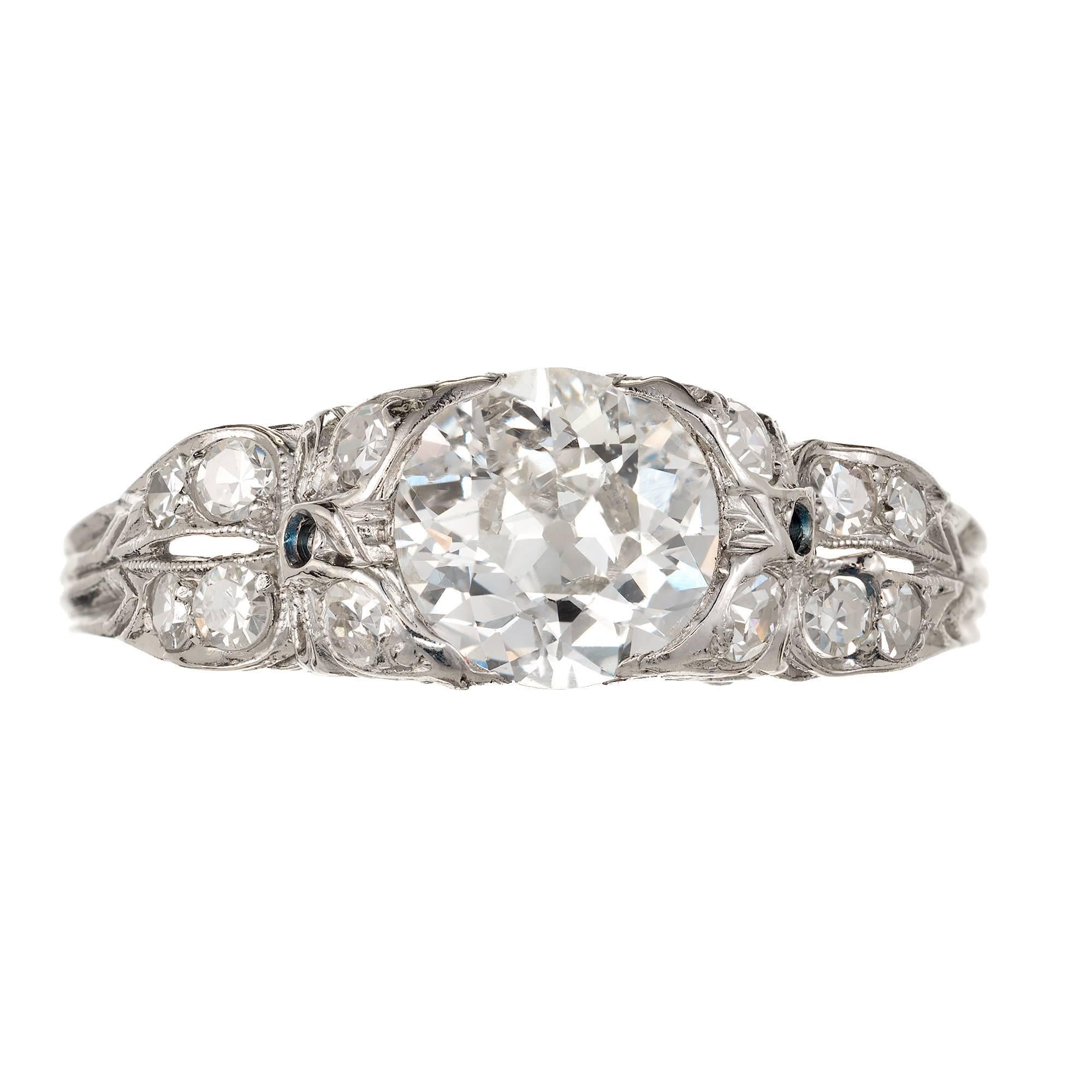 1900-1910 Edwardian Diamond Platinum engagement ring. 

1 original old European cut, approx. total weight 1.17ct, G, VS1, 7.03 x 6.83 x 3.67mm, Depth: 52.9%  Table: 51.0%, good polish and symmetry, brilliance 
12 single old cut diamonds, approx.