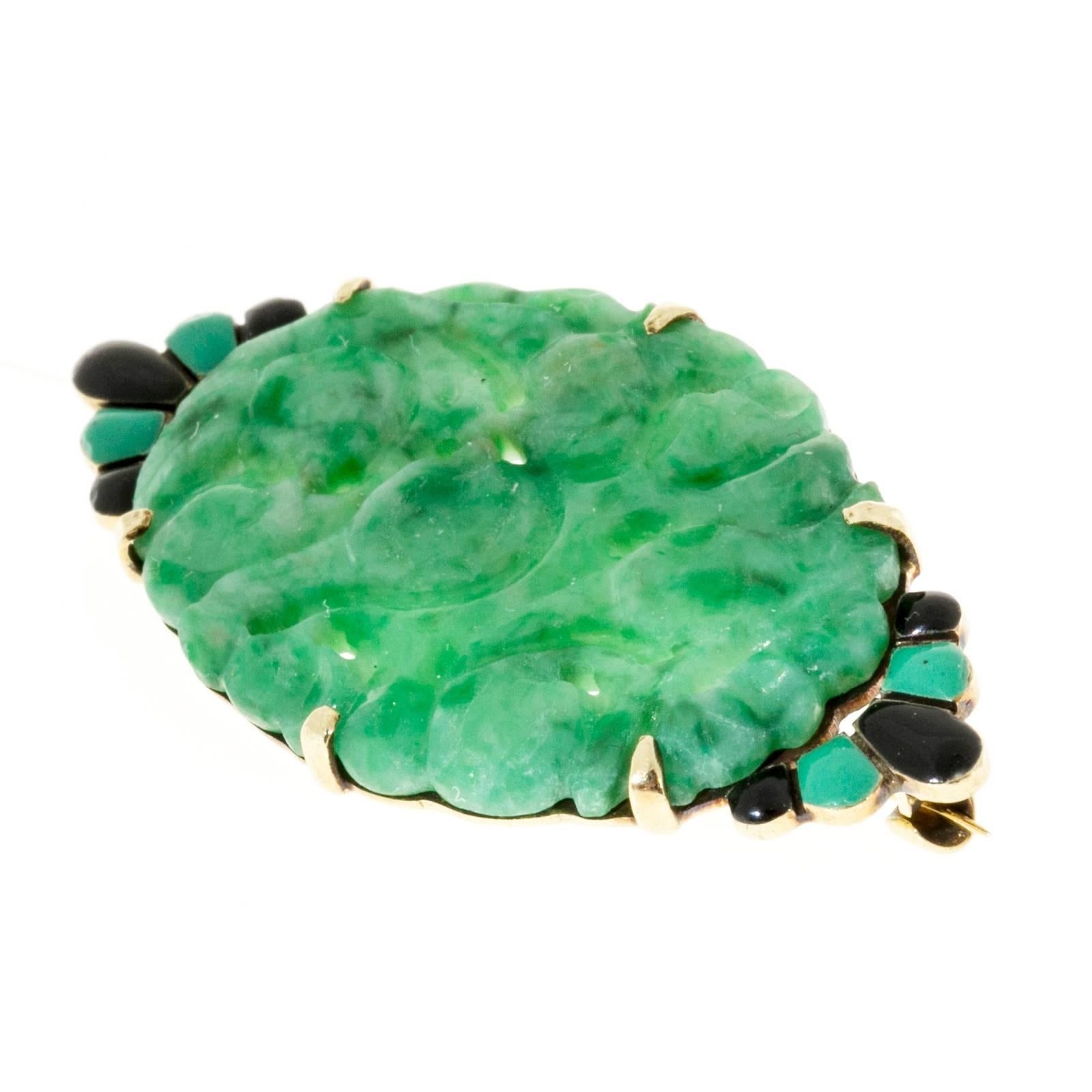 Original 1940 Art Deco pin with black and green enamel and natural green Jadeite Jade.

GIA certified natural color non enhanced Jadeite Jade 28.75 x 19.70 x 2.85mm carved tablet. GIA 2155122484
14k Yellow Gold
Stamped: 14k WL
Black and green