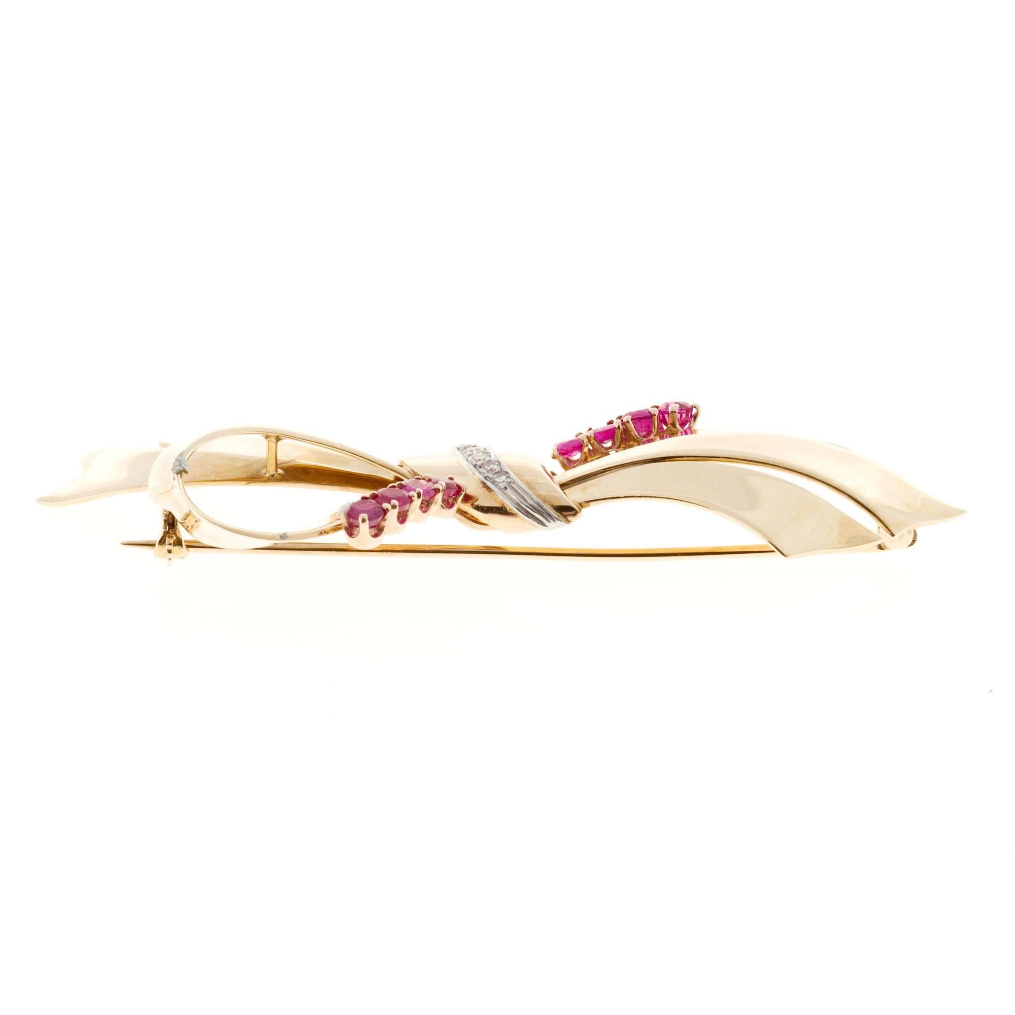 Authentic original Tiffany & Co 14k pink gold and platinum bow style pin with natural genuine pinkish red Rubies and genuine diamonds. 

6 round diamonds, approx. total weight .07cts, F, VS
8 genuine natural pink Rubies 3mm, approx. total weight