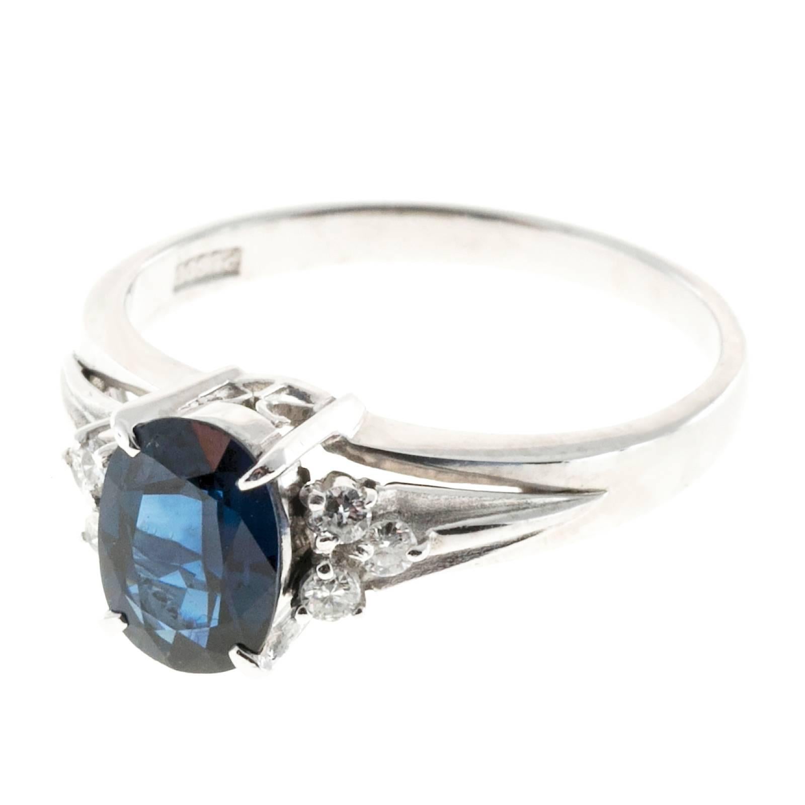 Oval sapphire Platinum engagement ring with white side diamonds.

1, 7.9 x 5.7mm oval Sapphire, approx. total weight 1.45cts, natural color and simple heat only
6 full cut diamonds, approx. total weight .12cts, H, VS
Platinum
Stamped: Pt 900 .12
4.3
